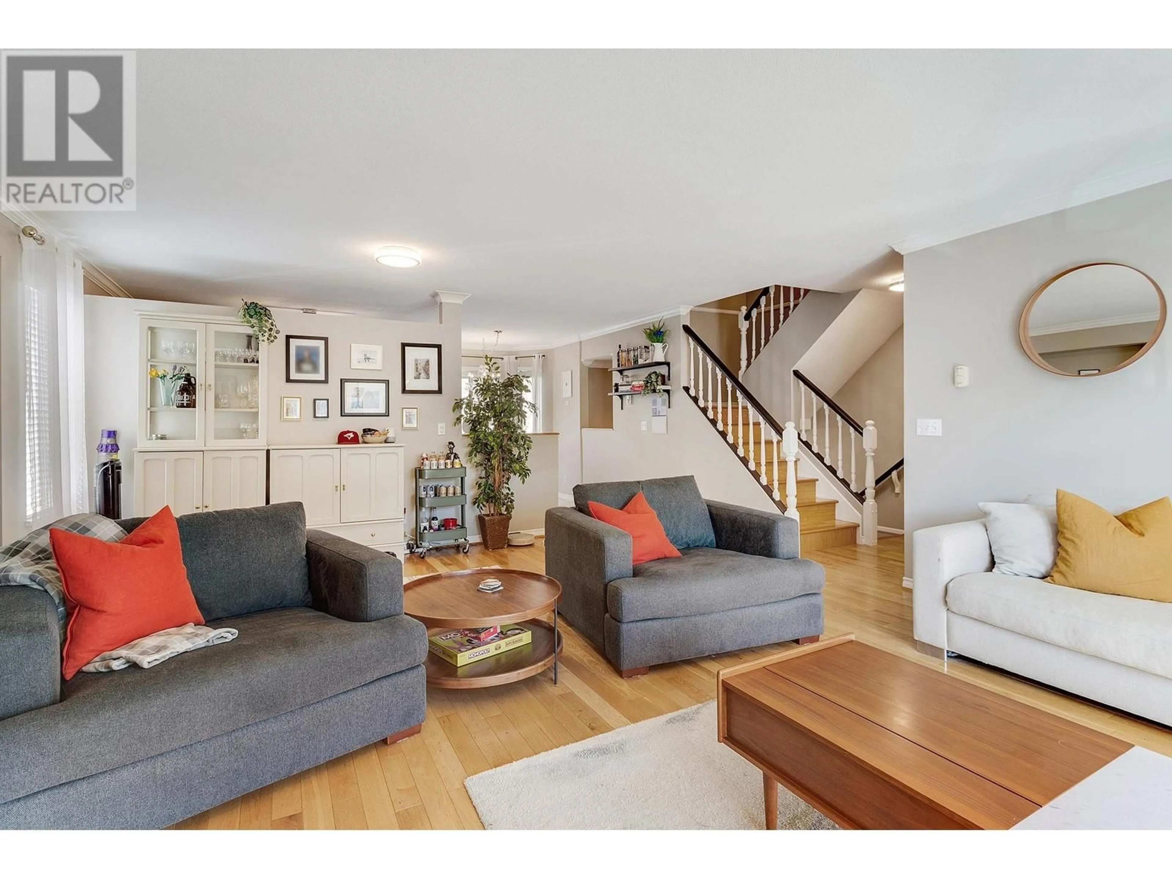 Living room with furniture, wood/laminate floor for 19 - 2420 PITT RIVER ROAD, Port Coquitlam British Columbia V3C1R9