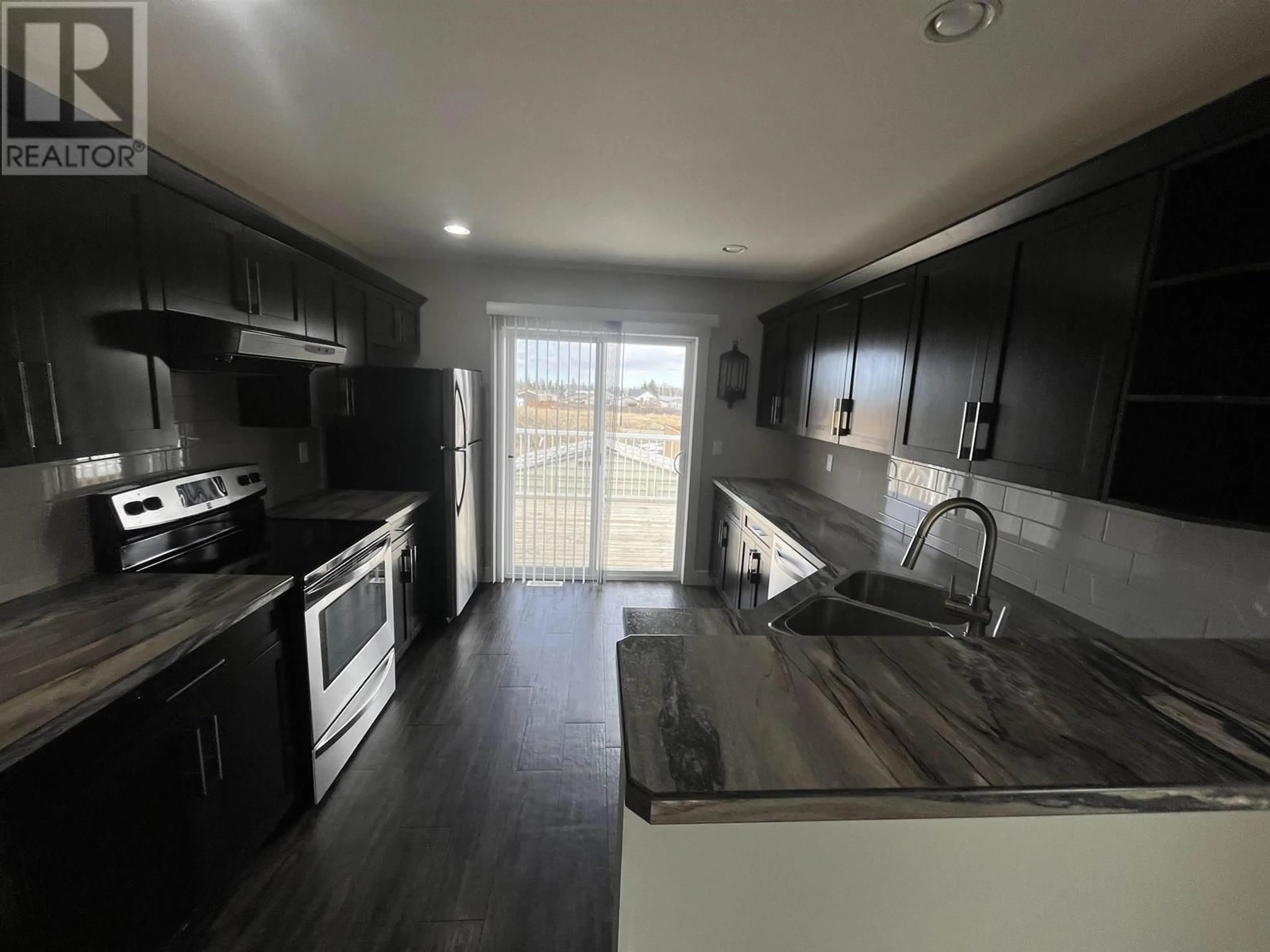 Open concept kitchen, unknown for 8615 81A STREET, Fort St. John British Columbia V1J0M5