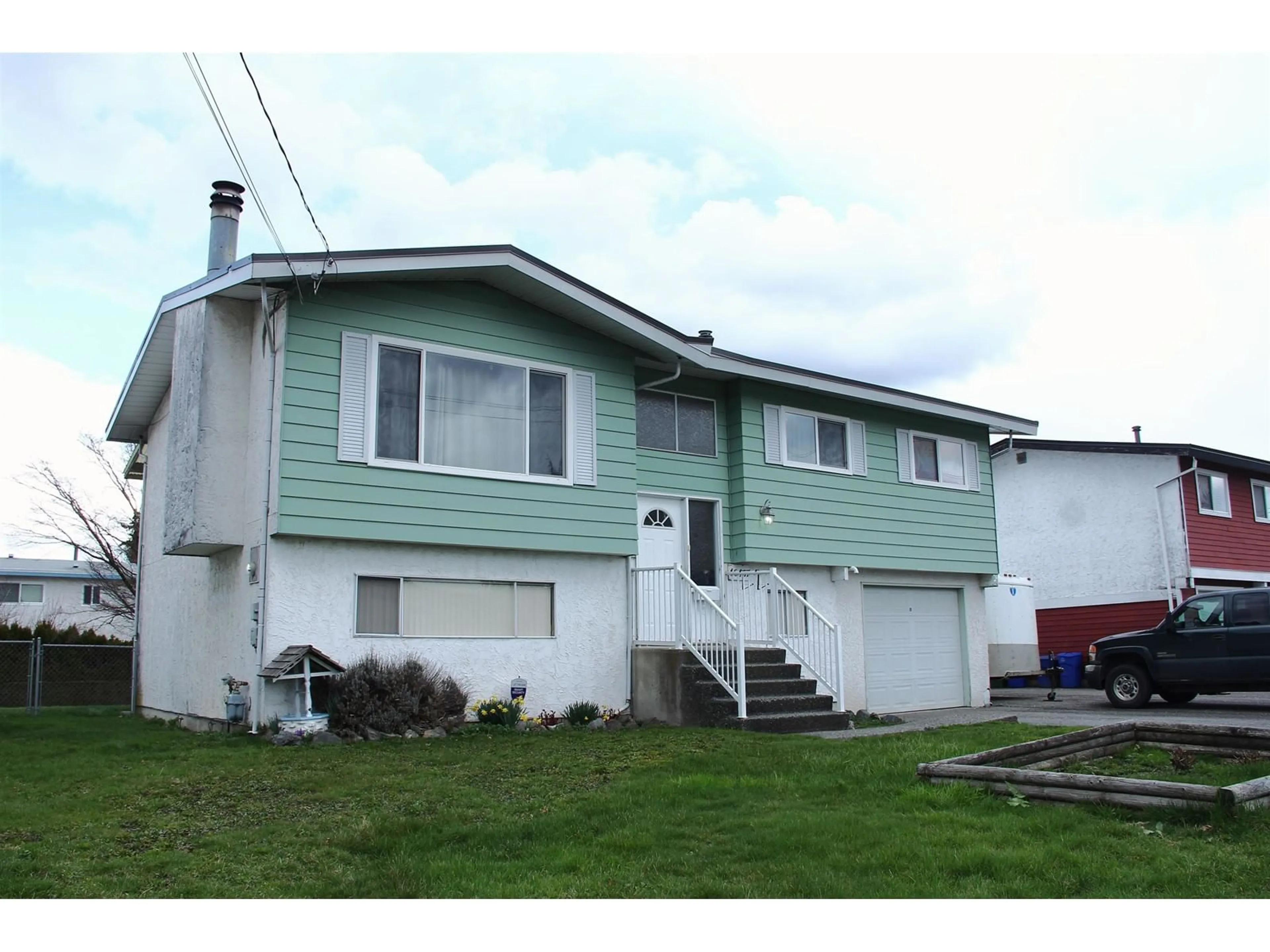 Home with vinyl exterior material, street for 46407 CHILLIWACK CENTRAL ROAD, Chilliwack British Columbia V2P1J7
