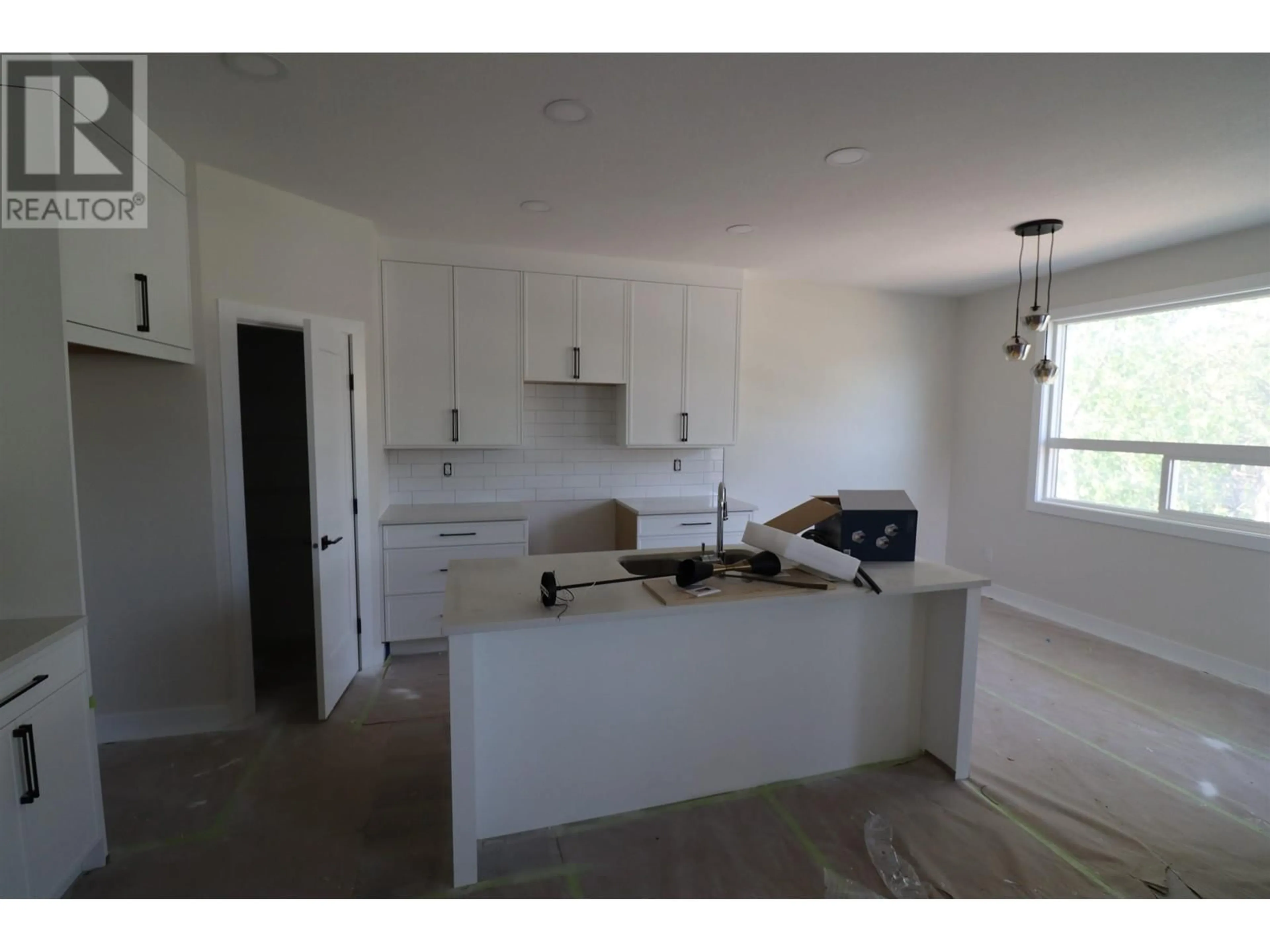 Open concept kitchen, unknown for 1850 6TH AVENUE, Prince George British Columbia V2M1L6