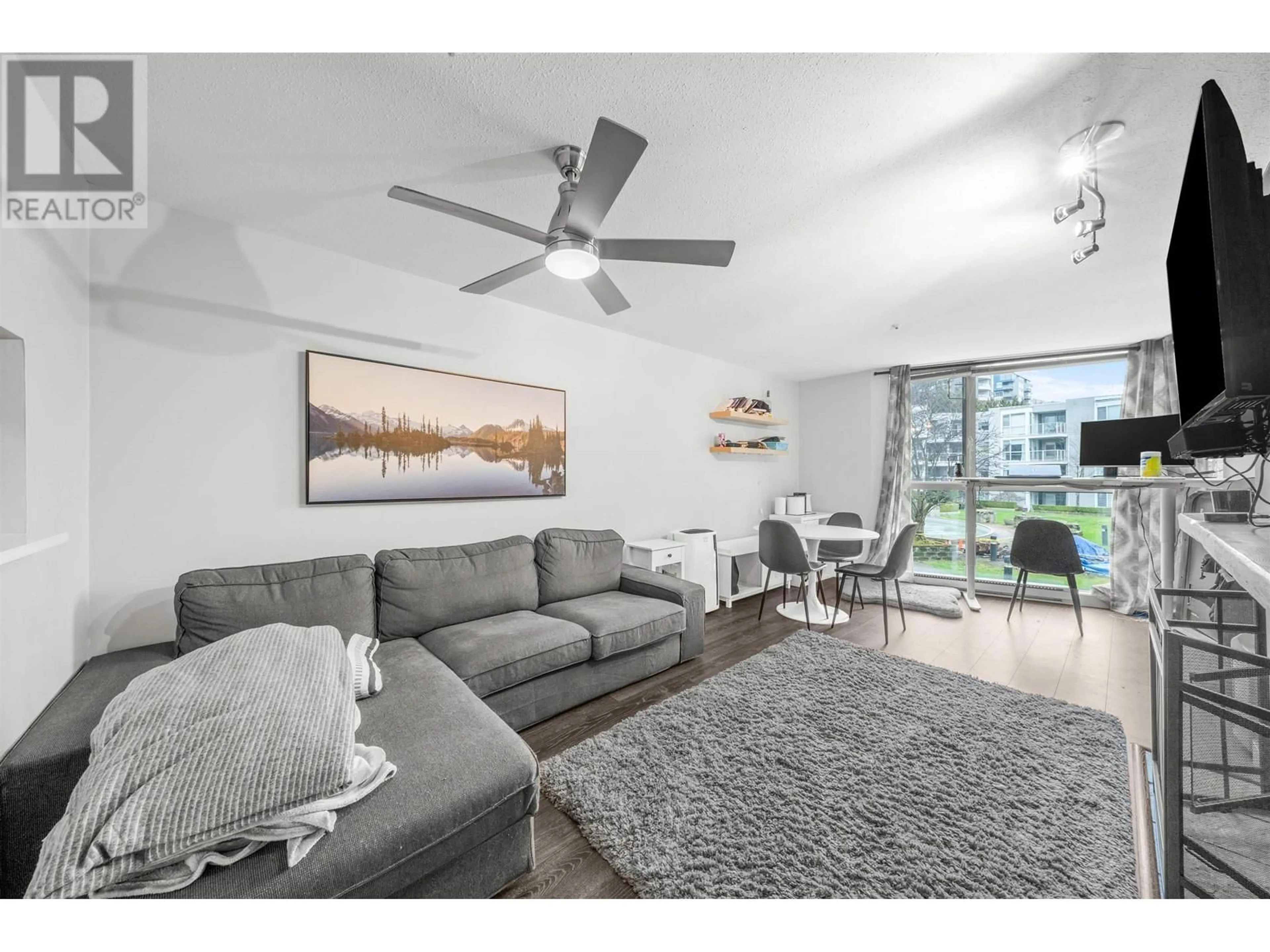Living room with furniture, unknown for 207 8460 JELLICOE STREET, Vancouver British Columbia V5S4S8
