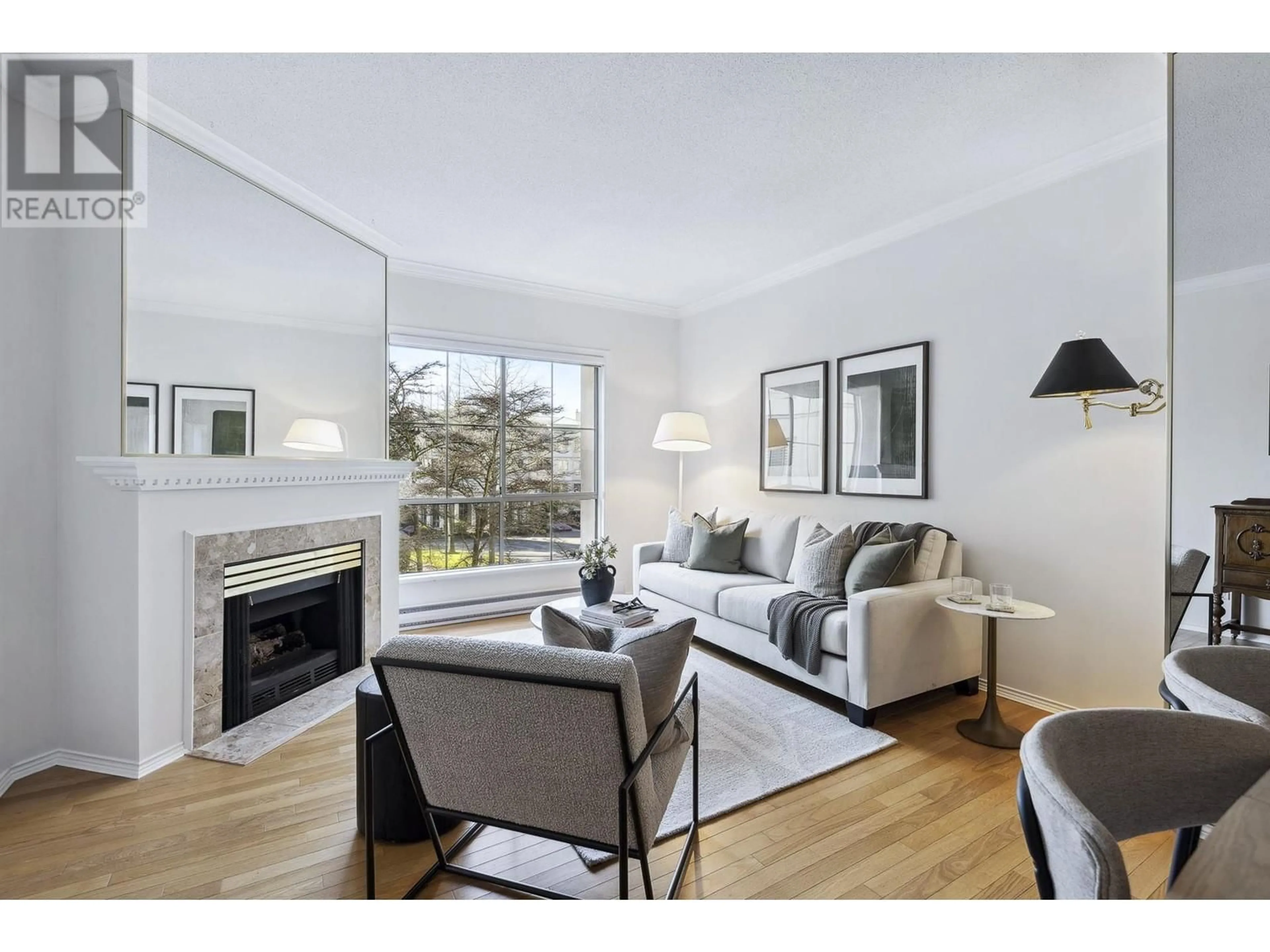 Living room with furniture, wood/laminate floor for 214 - 8580 GENERAL CURRIE ROAD, Richmond British Columbia V6Y3V5