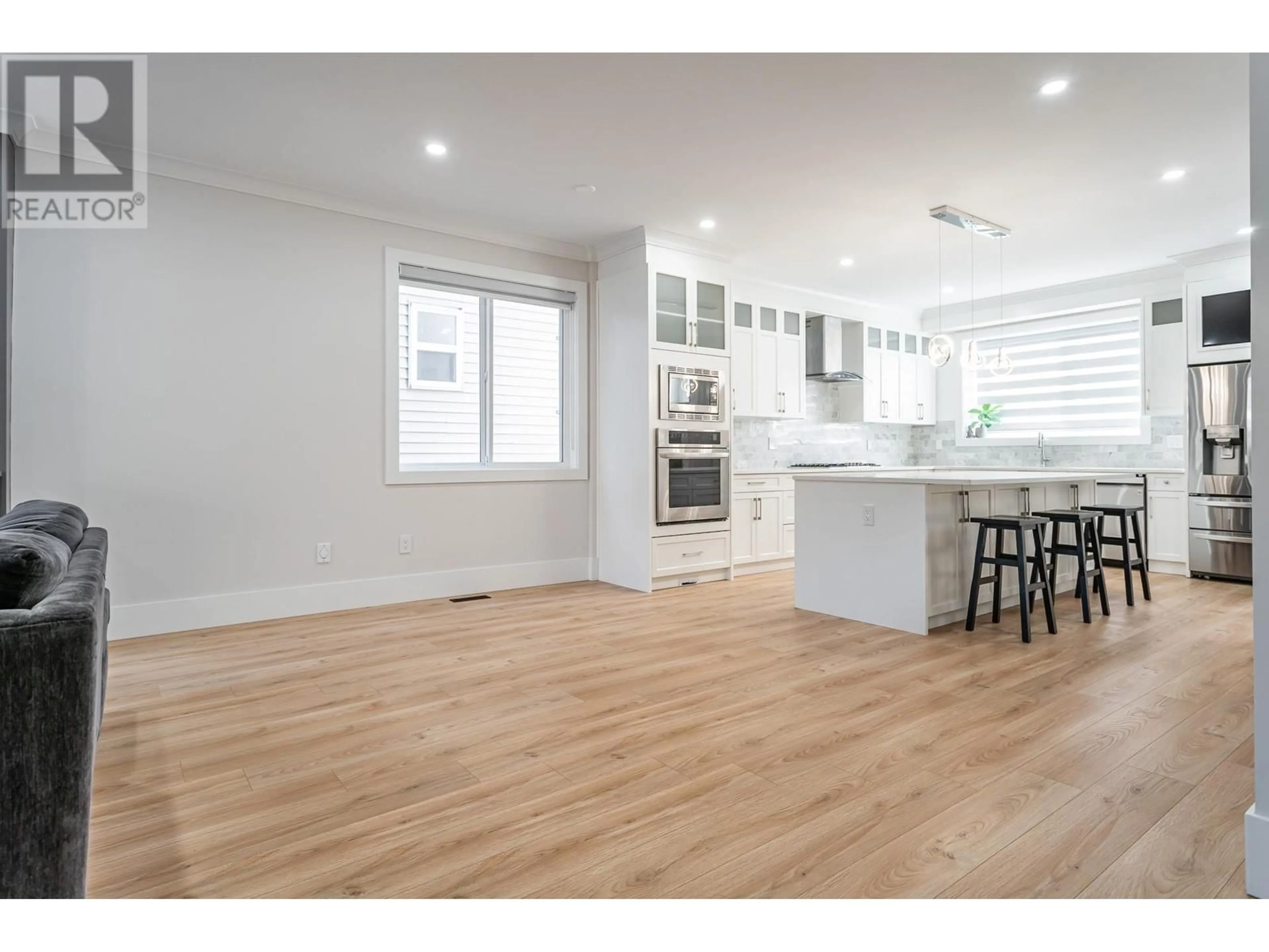 Open concept kitchen, wood/laminate floor for 3409 VICTORIA DRIVE, Coquitlam British Columbia V3B2V5