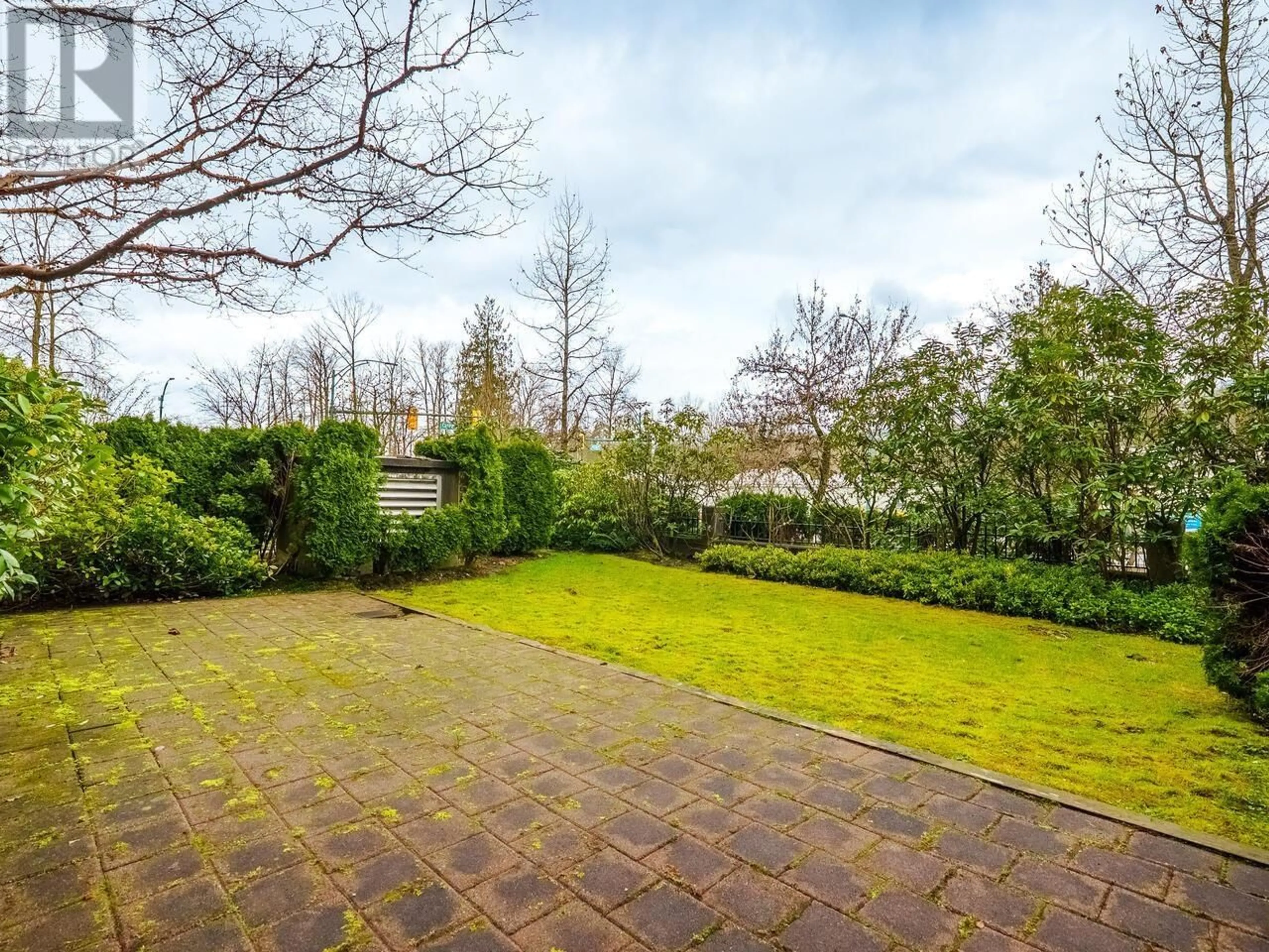 A pic from outside/outdoor area/front of a property/back of a property/a pic from drone, forest/trees view for 105 - 100 CAPILANO ROAD, Port Moody British Columbia V3H5M9