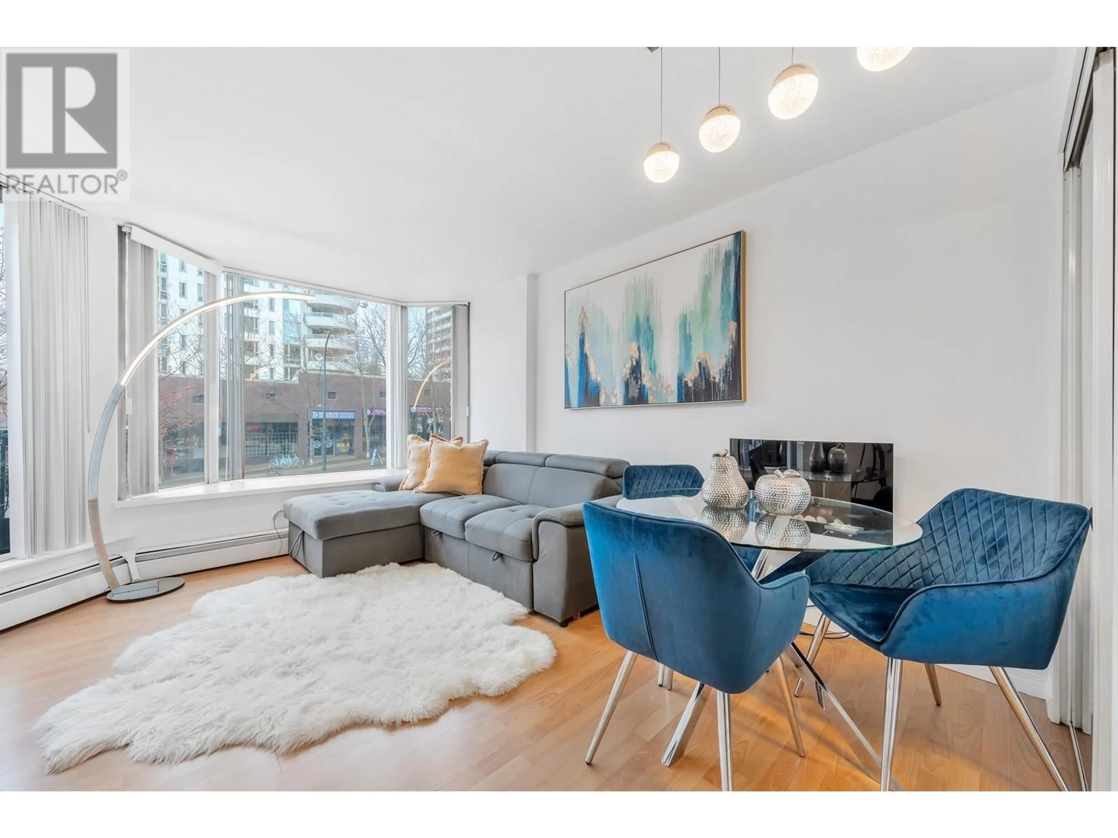 Living room with furniture, wood/laminate floor for 209 - 1330 BURRARD STREET, Vancouver British Columbia V6Z2B8