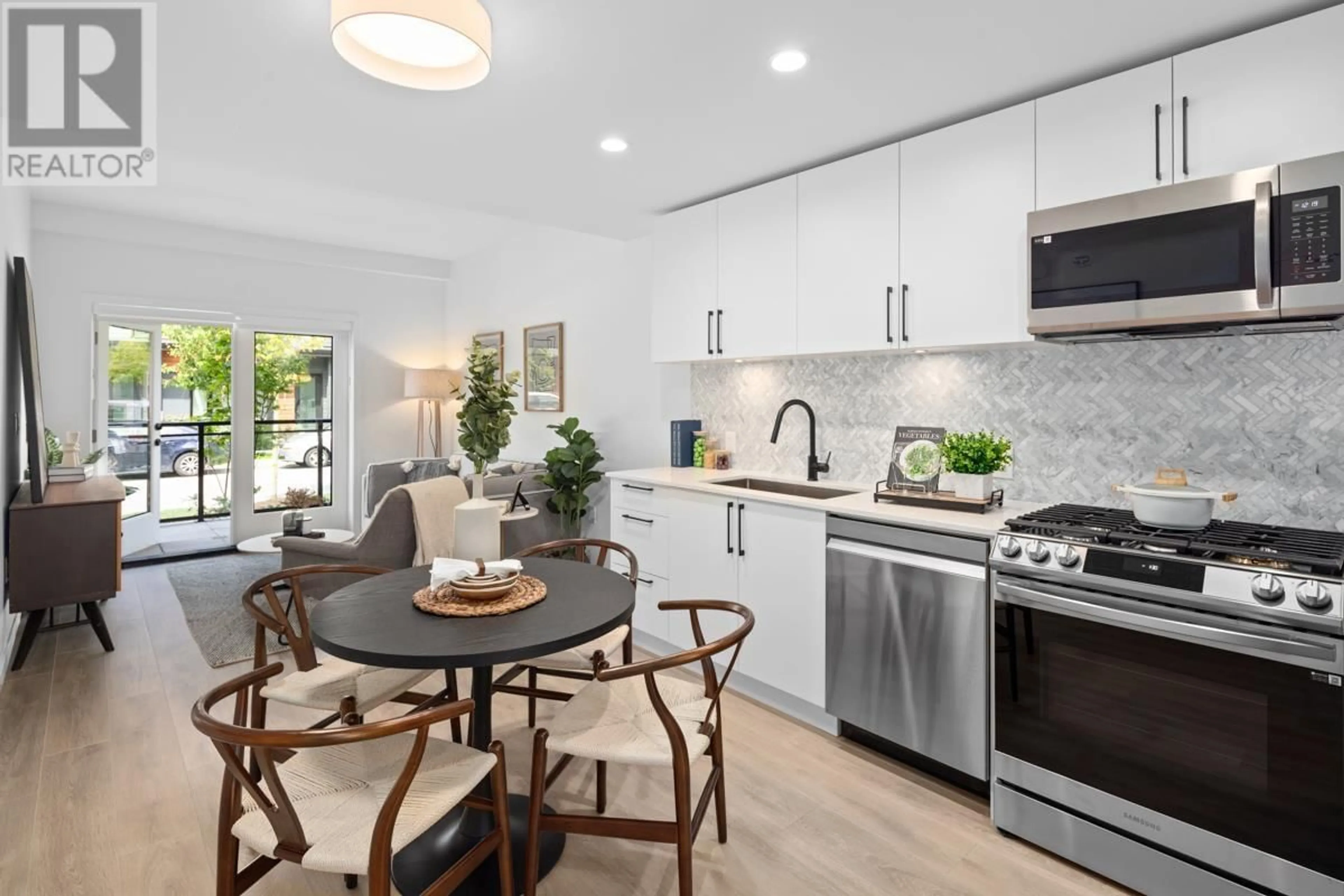 Open concept kitchen, ceramic/tile floor for 244 - 545 2ND STREET, North Vancouver British Columbia V7L1E1