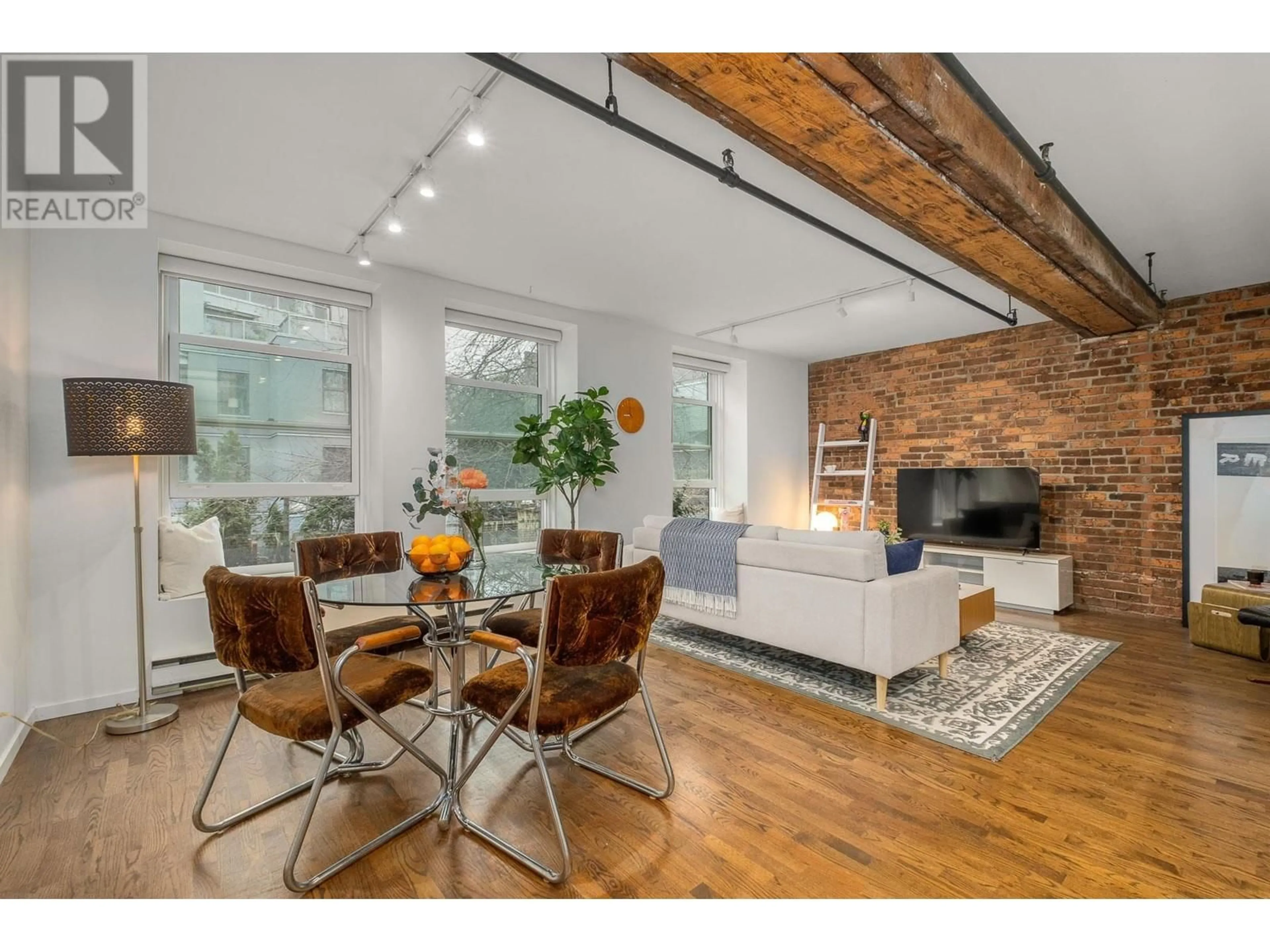Living room with furniture, unknown for 203 - 150 ALEXANDER STREET, Vancouver British Columbia V6A1B5