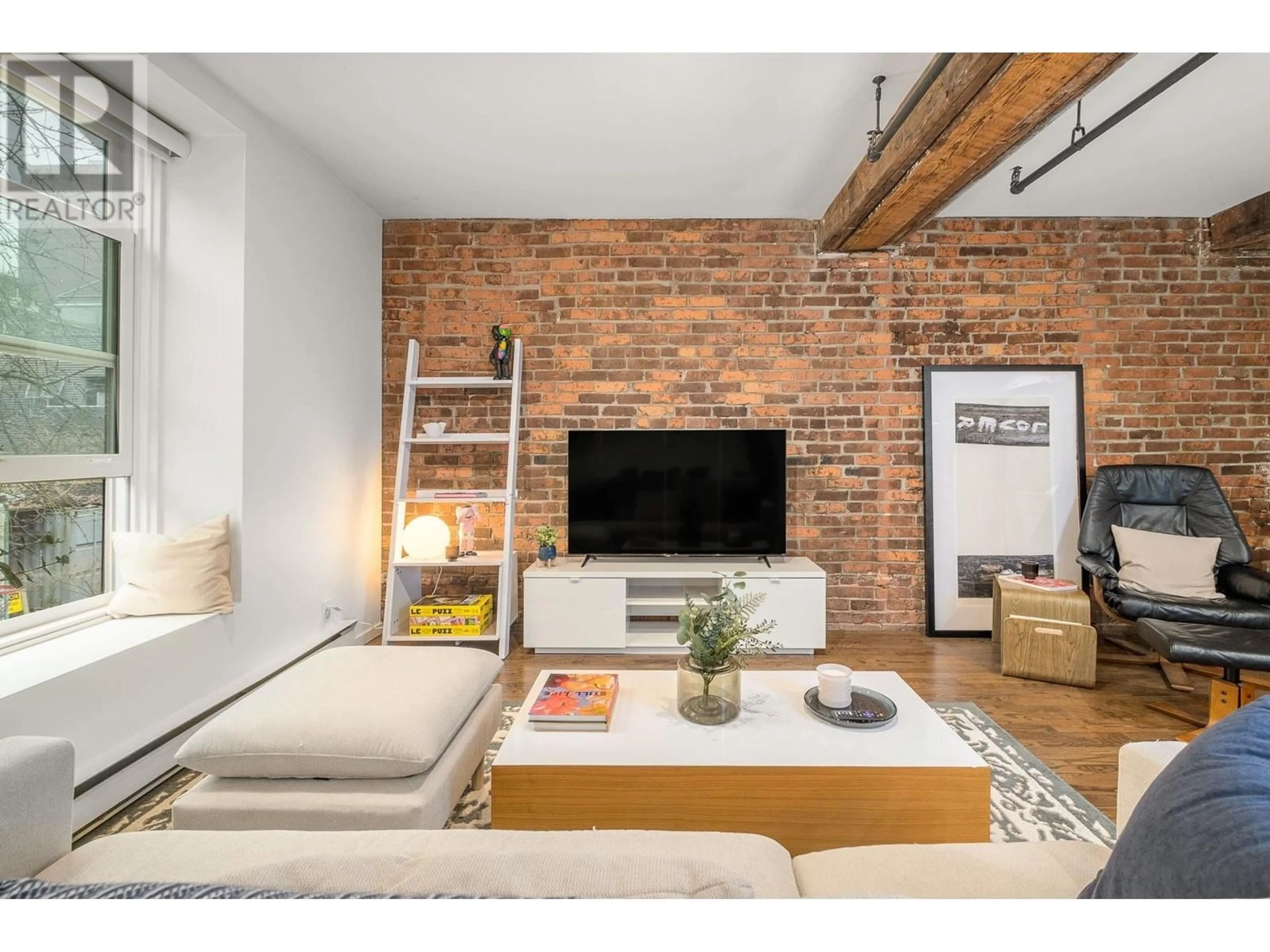 Living room with furniture, unknown for 203 - 150 ALEXANDER STREET, Vancouver British Columbia V6A1B5