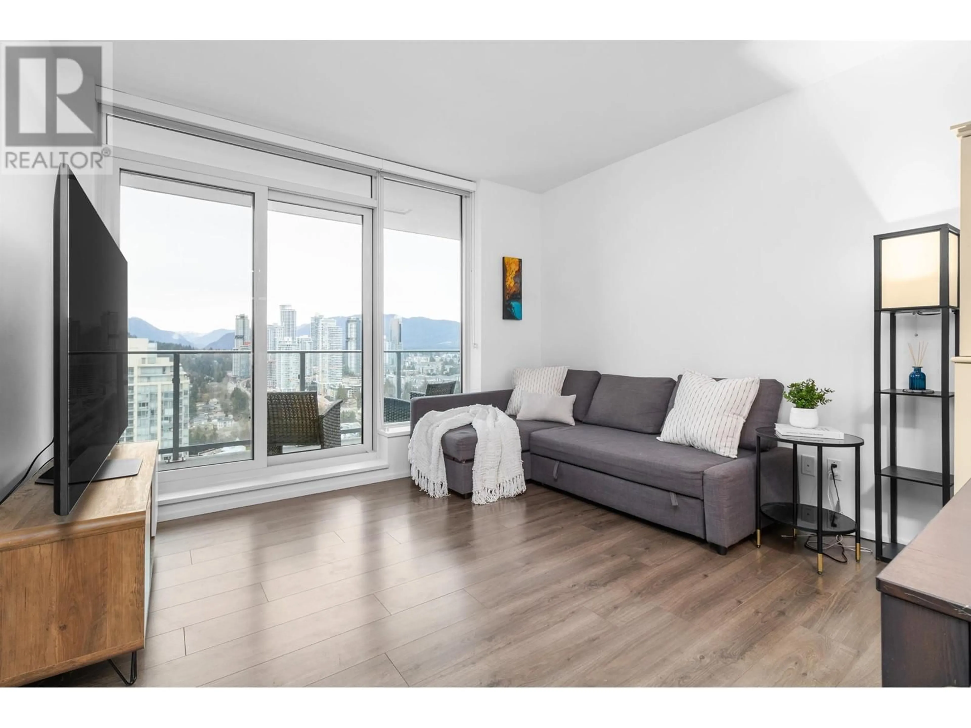 Living room with furniture, wood/laminate floor for 3511 - 3809 EVERGREEN PLACE, Burnaby British Columbia V3J0M1