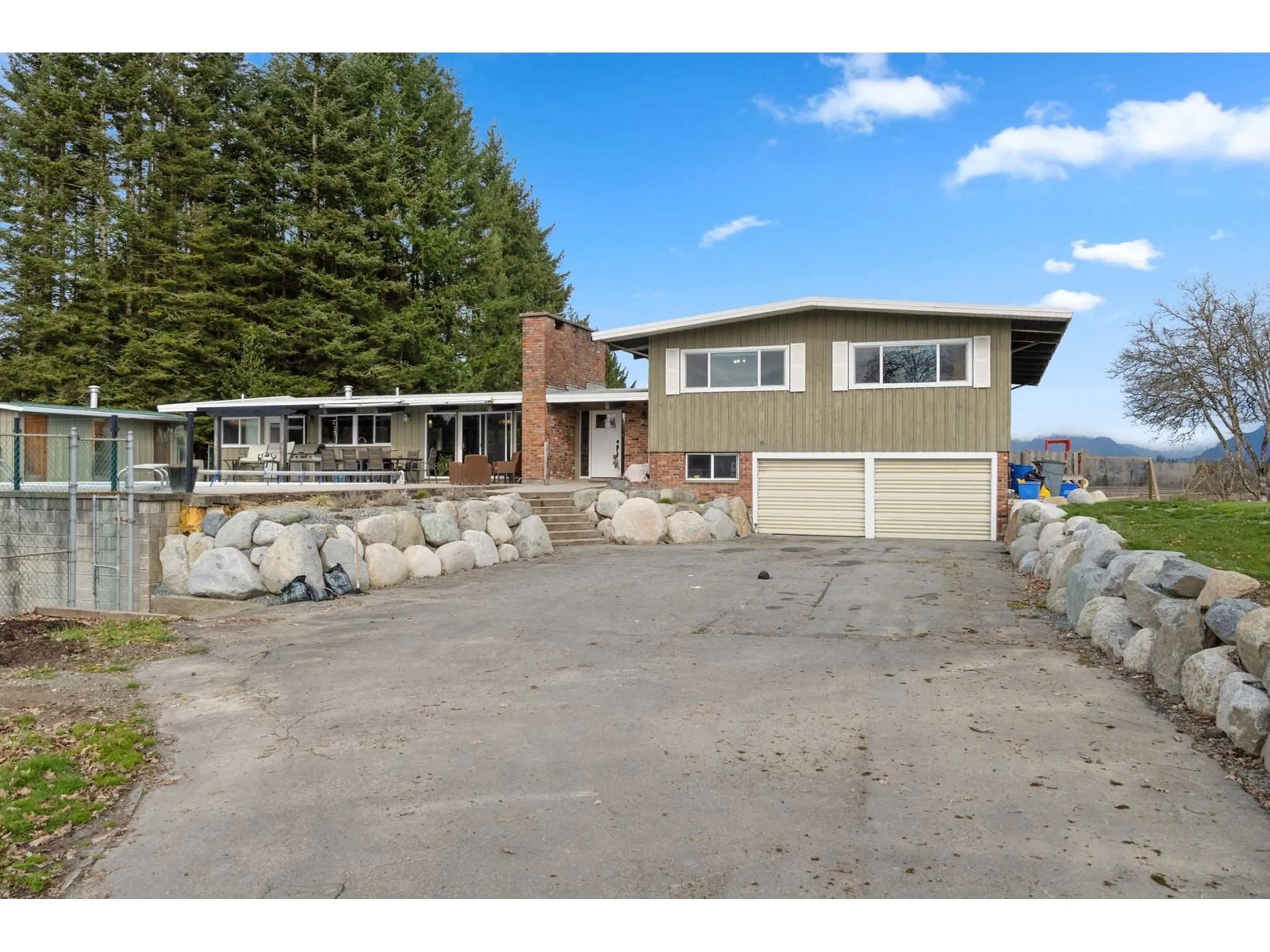 A pic from outside/outdoor area/front of a property/back of a property/a pic from drone, unknown for 21115 102B, Langley British Columbia V1M3J5