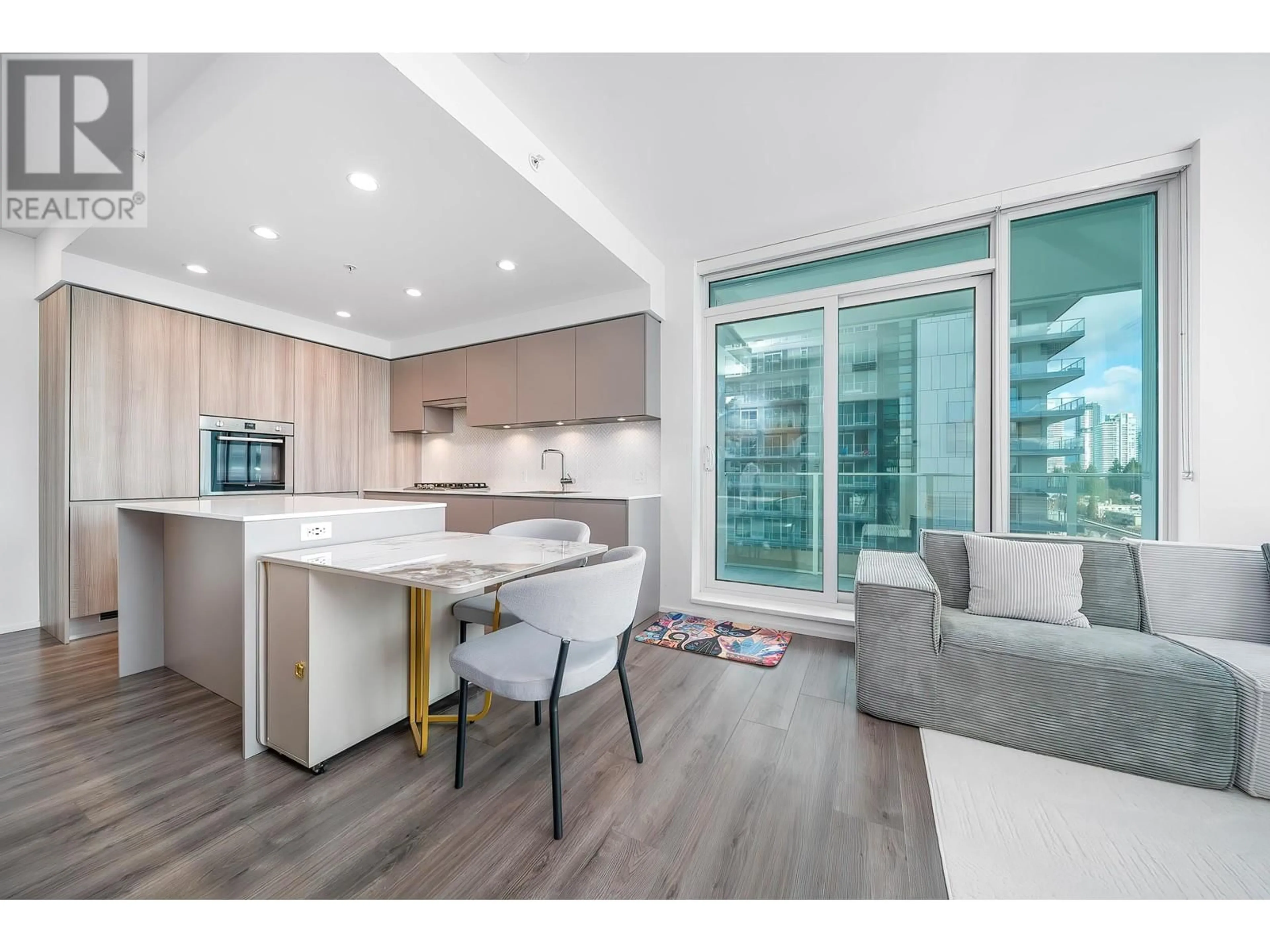 Open concept kitchen, wood/laminate floor for 1501 - 3833 EVERGREEN PLACE, Burnaby British Columbia V3J0M2