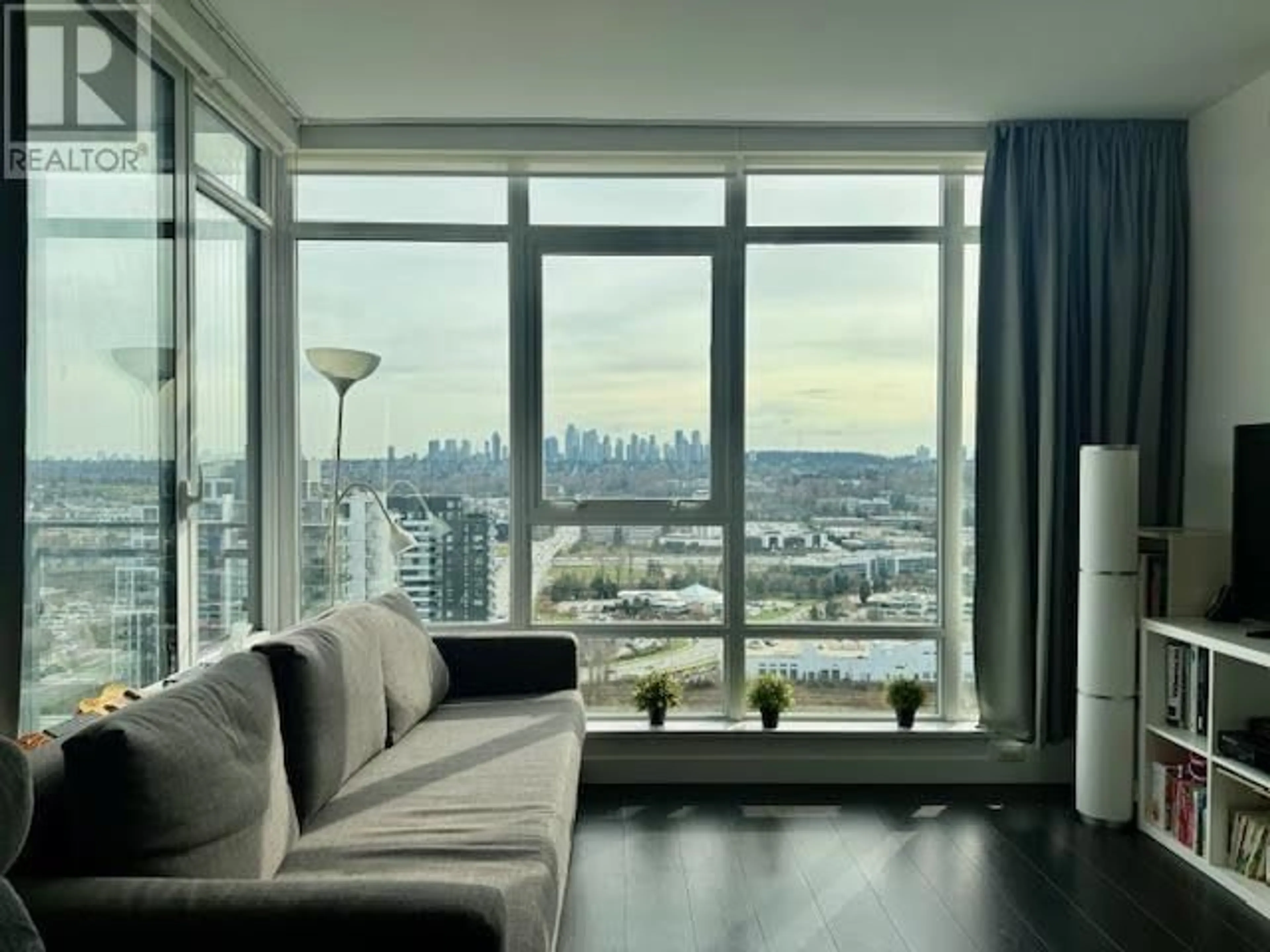 Living room with furniture, wood/laminate floor for 2306 - 2085 SKYLINE COURT, Burnaby British Columbia V5C0M6