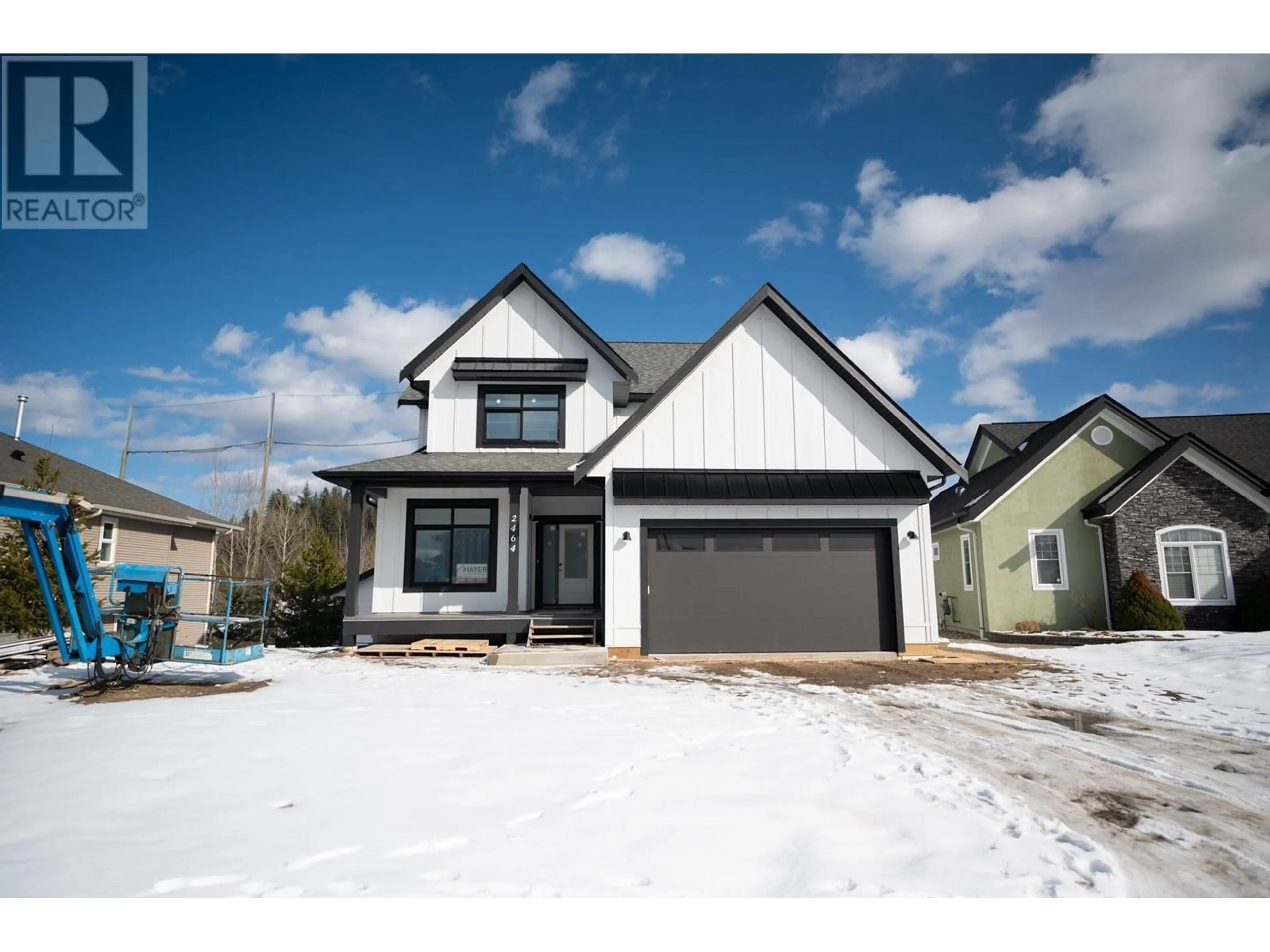 Home with vinyl exterior material, street for 2464 MCTAVISH ROAD, Prince George British Columbia V2K0A1