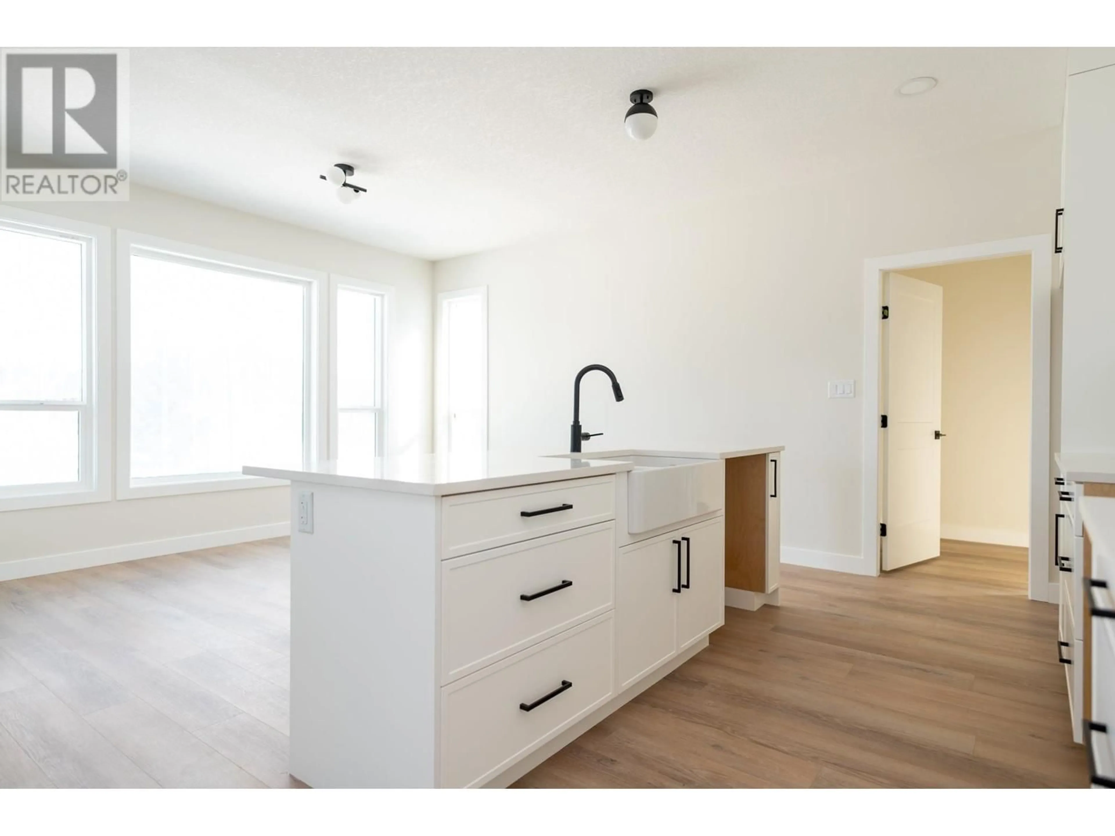 Open concept kitchen, wood/laminate floor for 2464 MCTAVISH ROAD, Prince George British Columbia V2K0A1