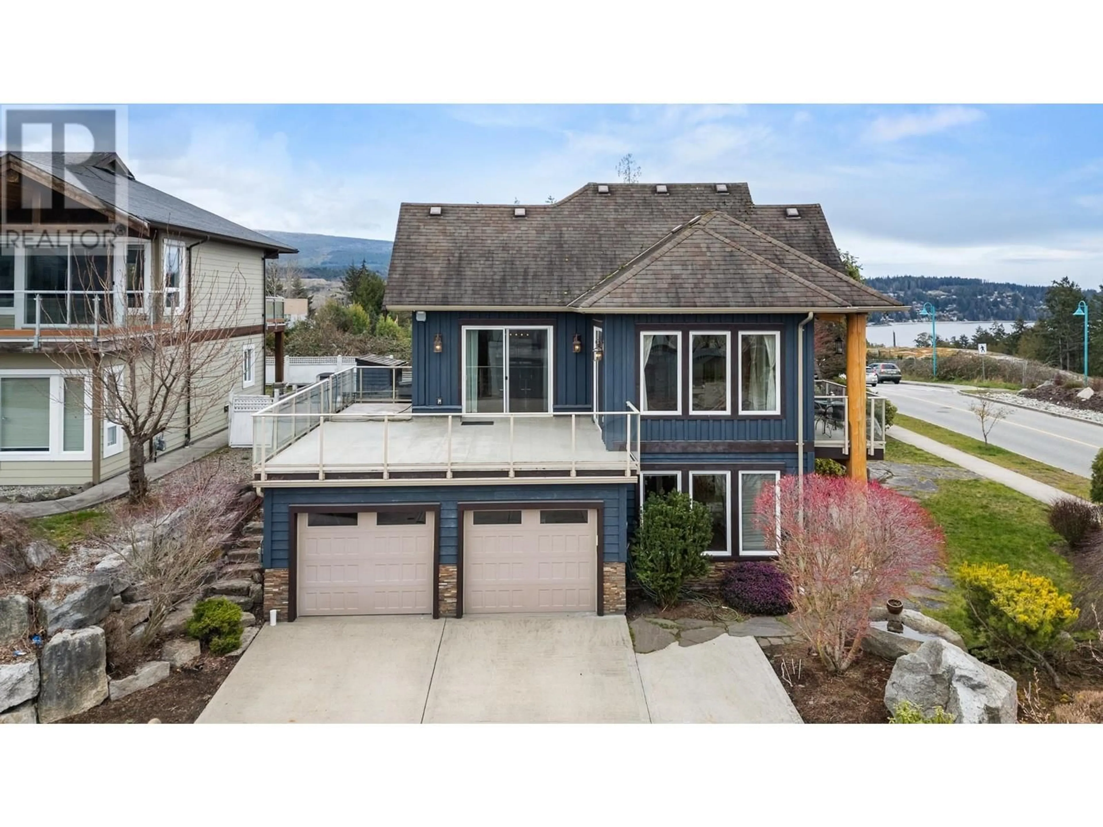 A pic from outside/outdoor area/front of a property/back of a property/a pic from drone, water/lake/river/ocean view for 5940 COWRIE STREET, Sechelt British Columbia V7Z0V1