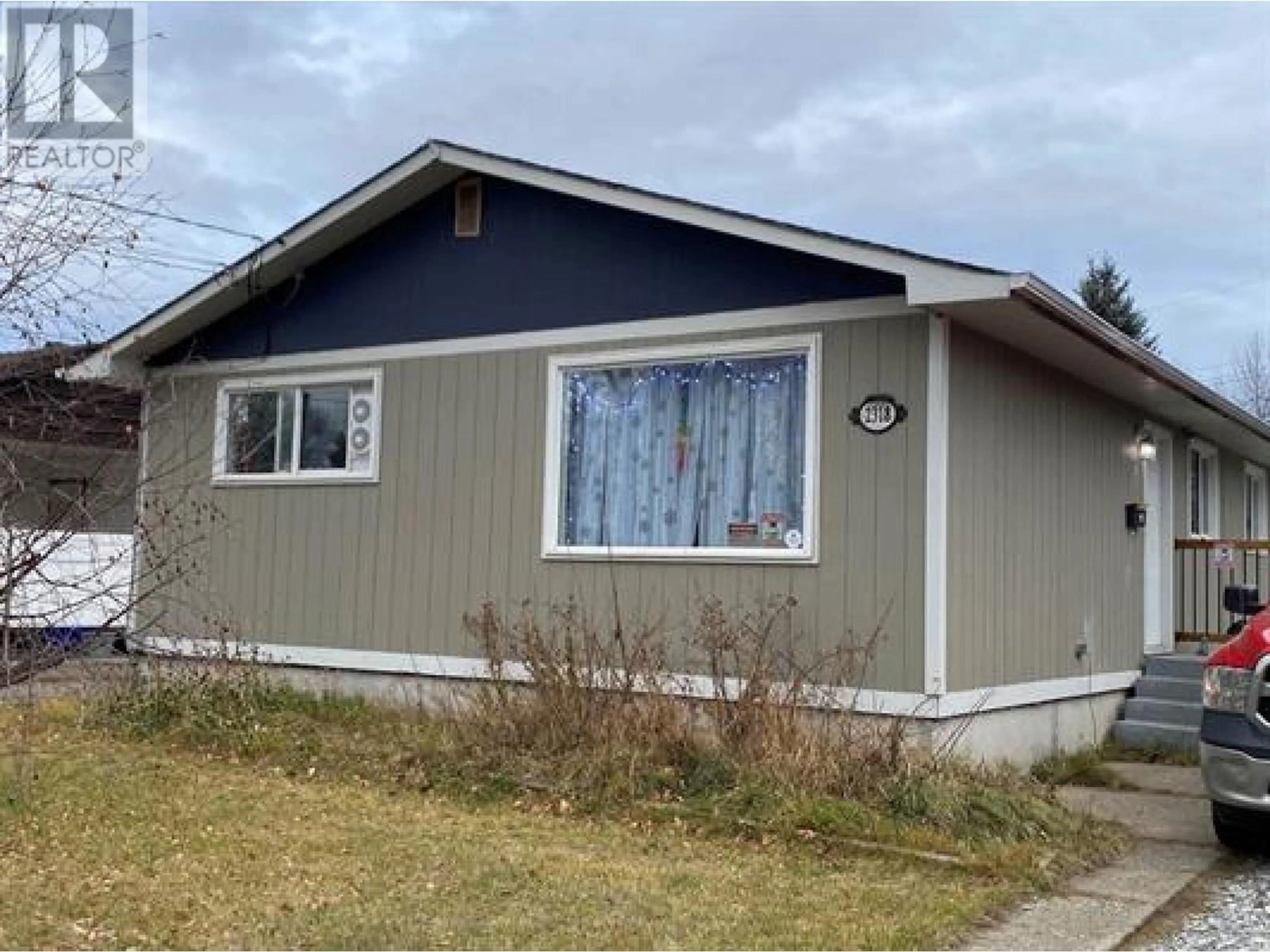 Home with vinyl exterior material, street for 2318 OAK STREET, Prince George British Columbia V2L2A3