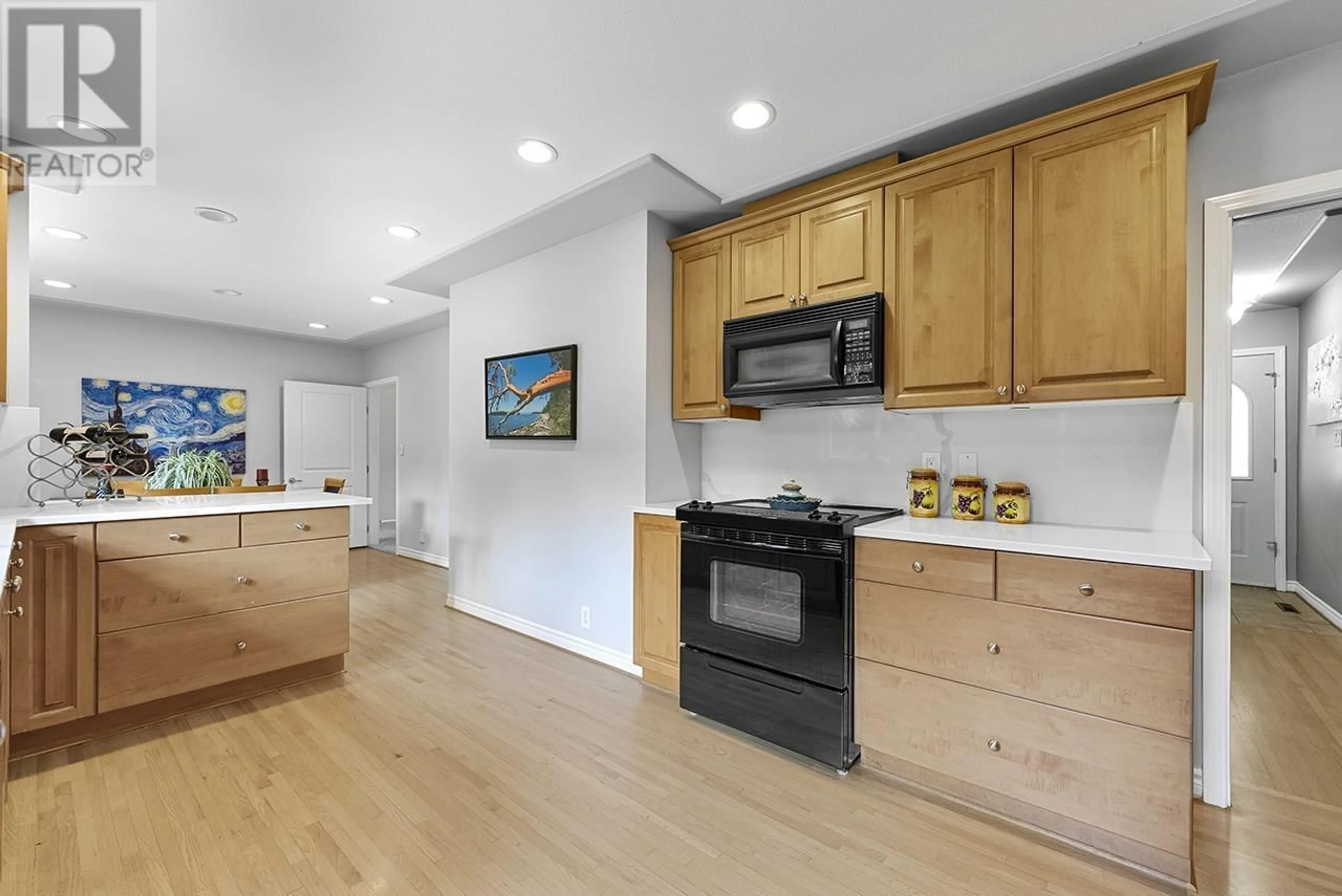 Open concept kitchen, wood/laminate floor for 5537 RUGBY STREET, Burnaby British Columbia V5E2N2