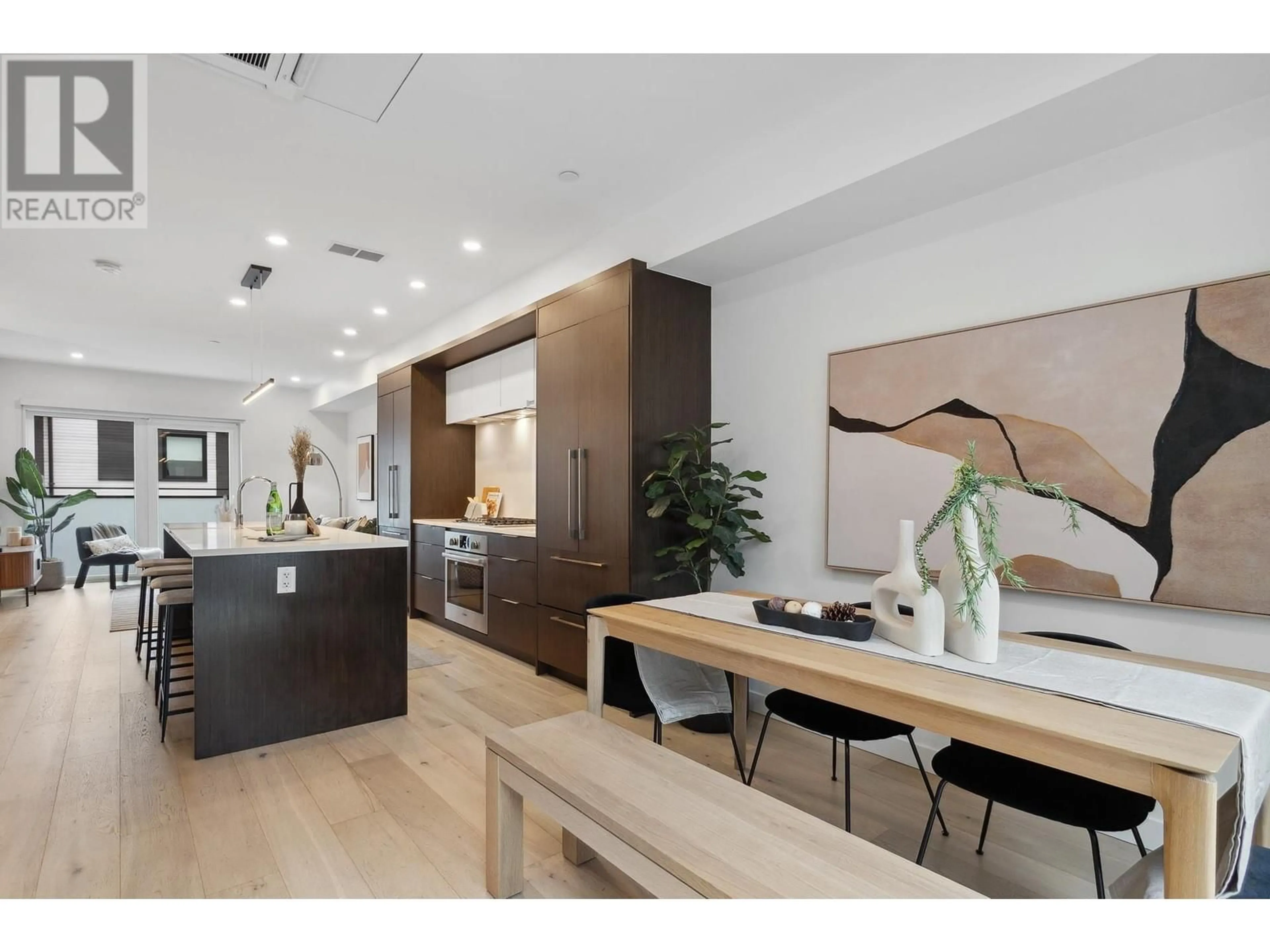 Open concept kitchen, wood/laminate floor for 121 - 649 E 3RD STREET, North Vancouver British Columbia V7L1G6