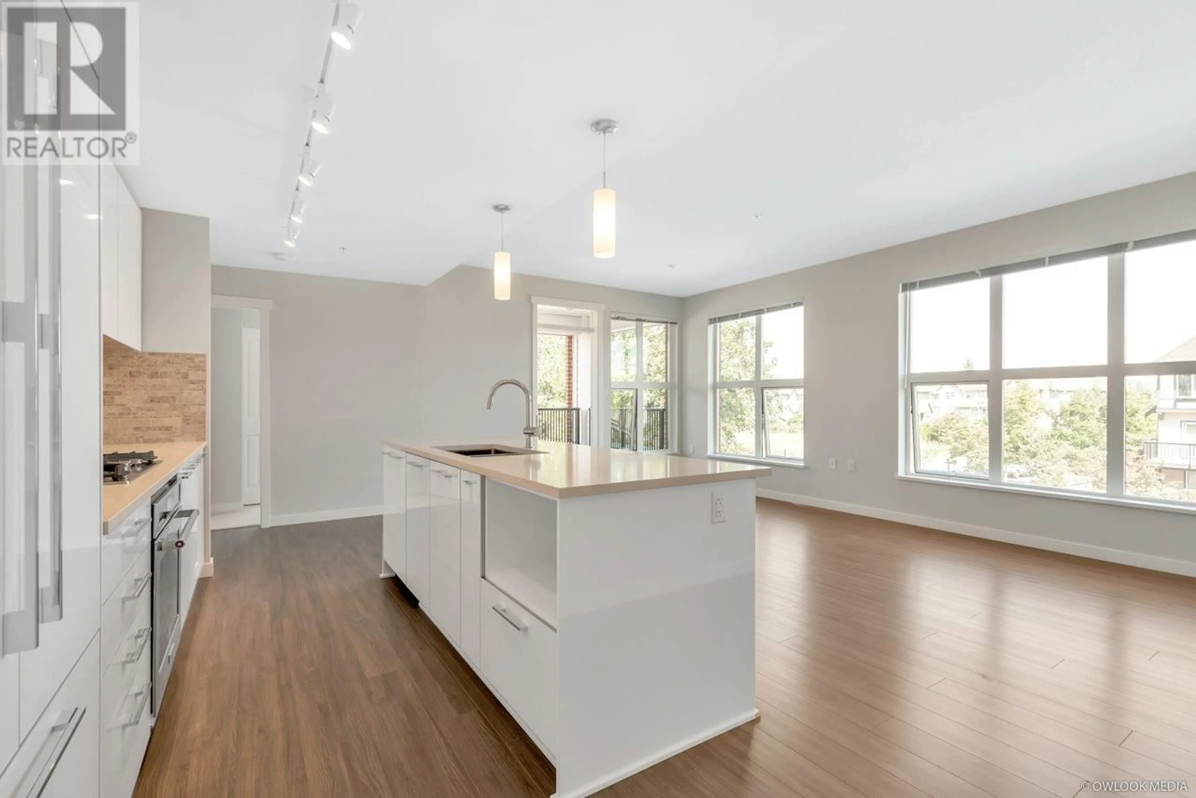 Open concept kitchen, wood/laminate floor for 205 - 9500 TOMICKI AVENUE, Richmond British Columbia V6X0R9