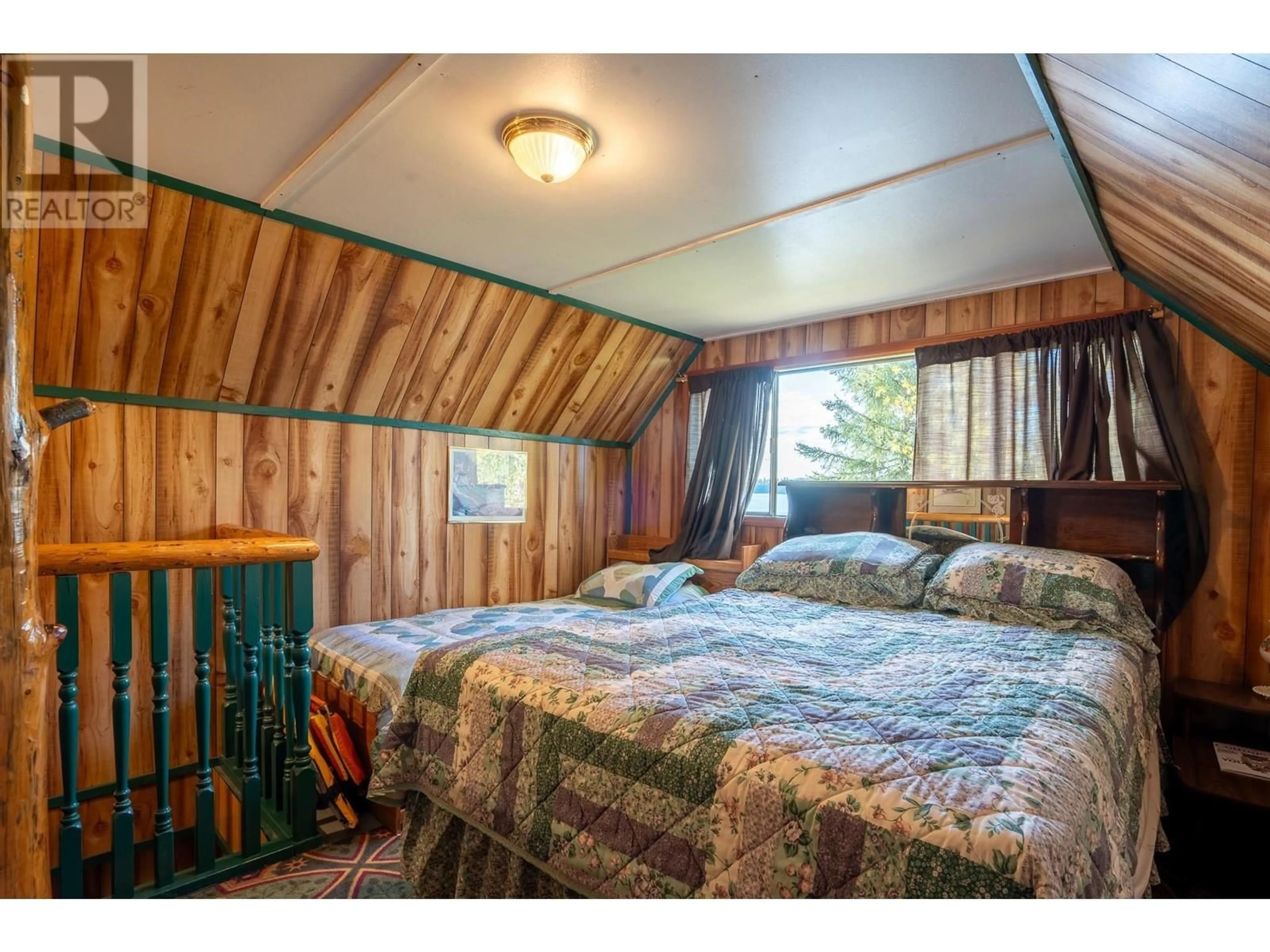 Bedroom with bed, wood/laminate floor for 52200 LLOYD DRIVE, Cluculz Lake British Columbia V0J3A3