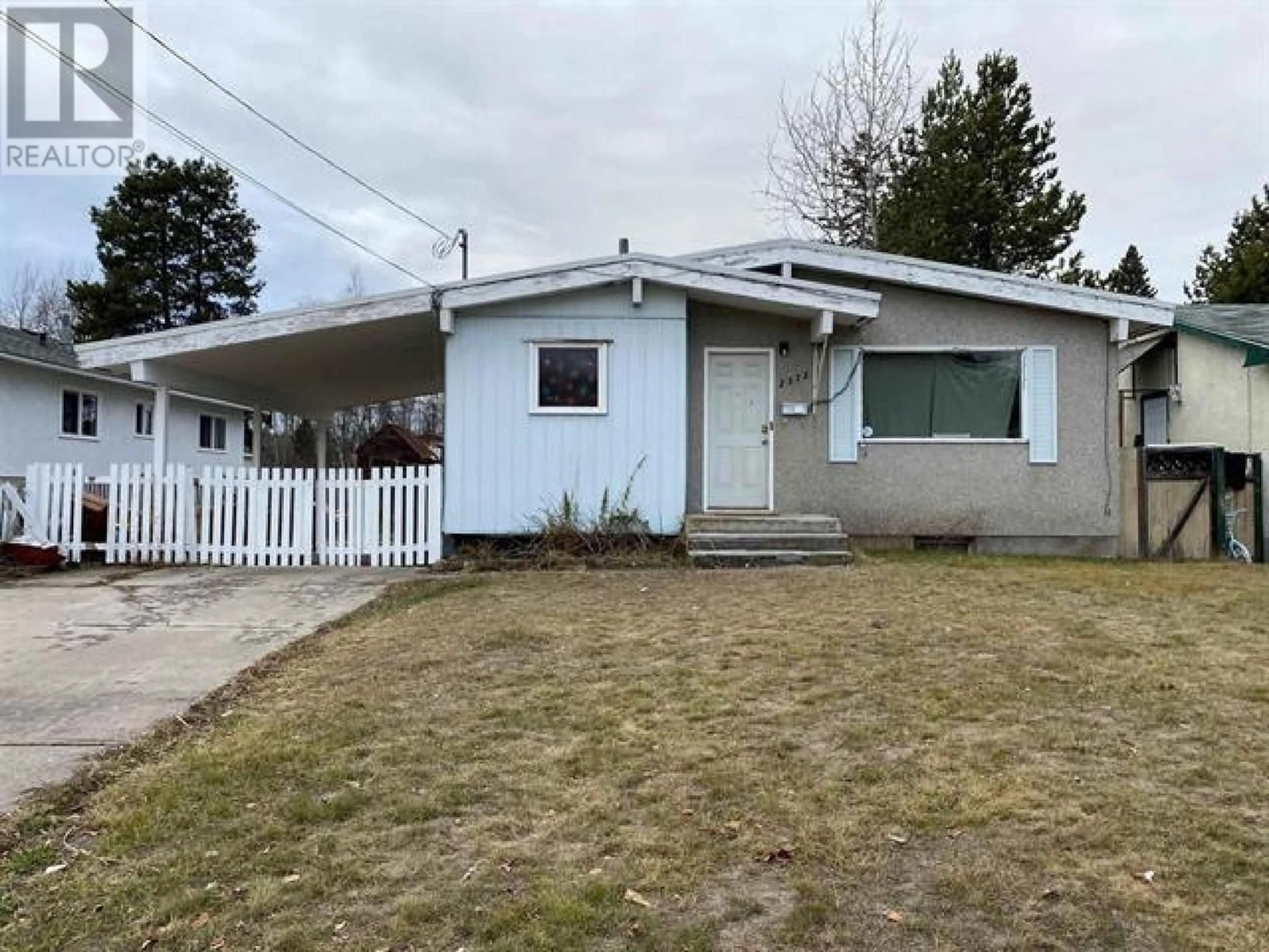 Home with vinyl exterior material, street for 2375 OAK STREET, Prince George British Columbia V2L2A3