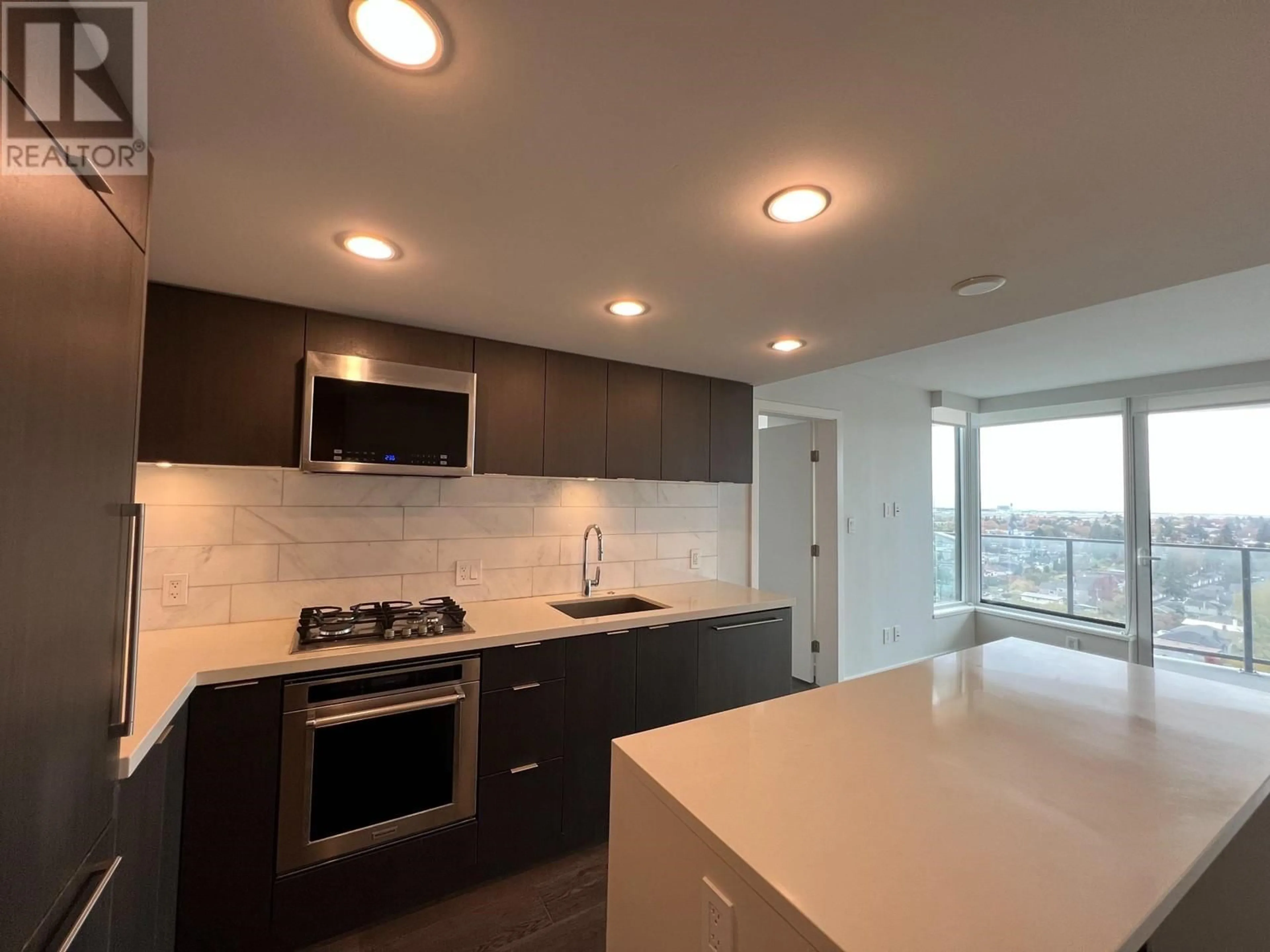 Open concept kitchen, ceramic/tile floor for 2002 - 8189 CAMBIE STREET, Vancouver British Columbia V6P0G6