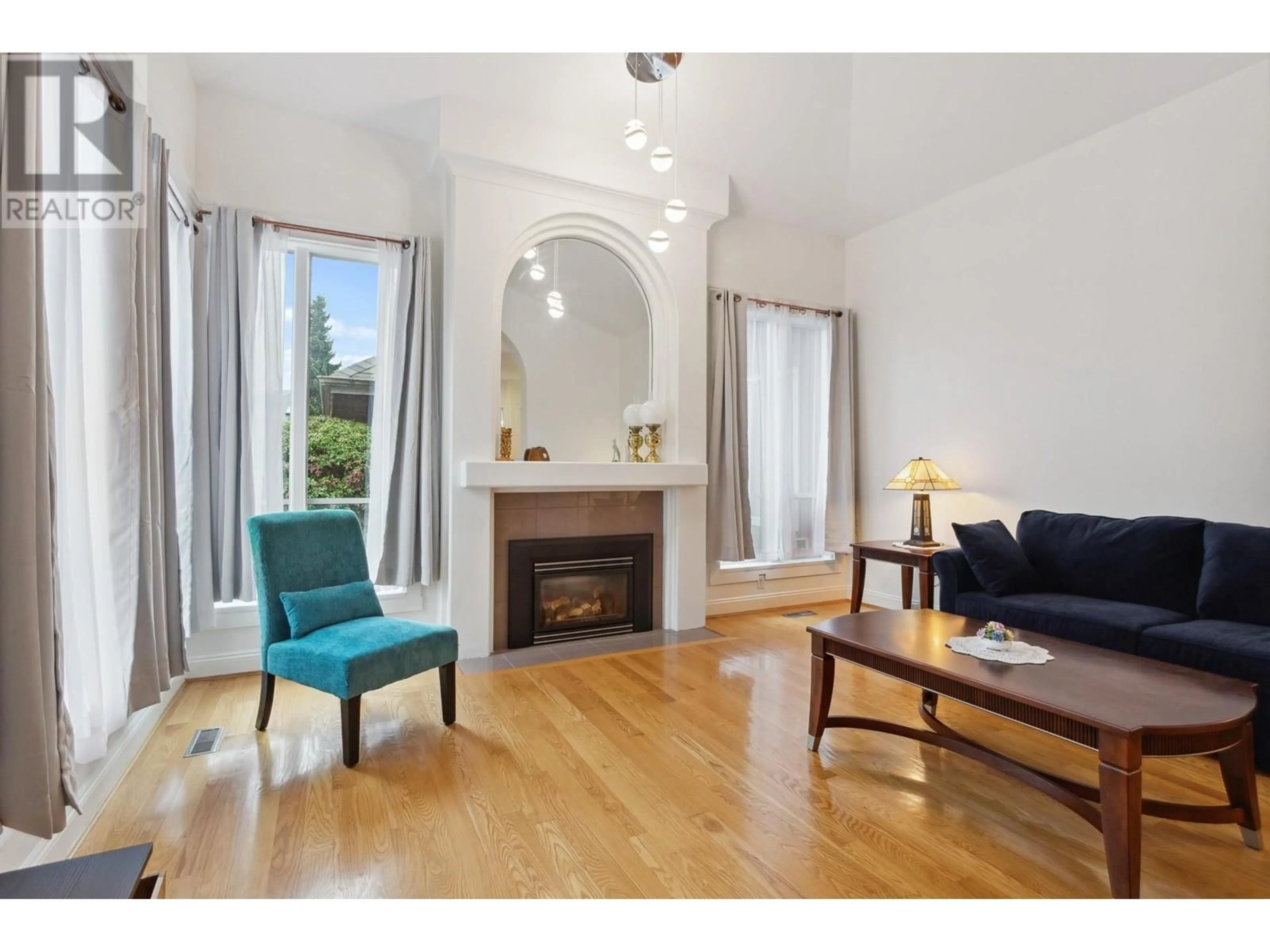 Living room with furniture, wood/laminate floor for 2274 SORRENTO DRIVE, Coquitlam British Columbia V3K6P4