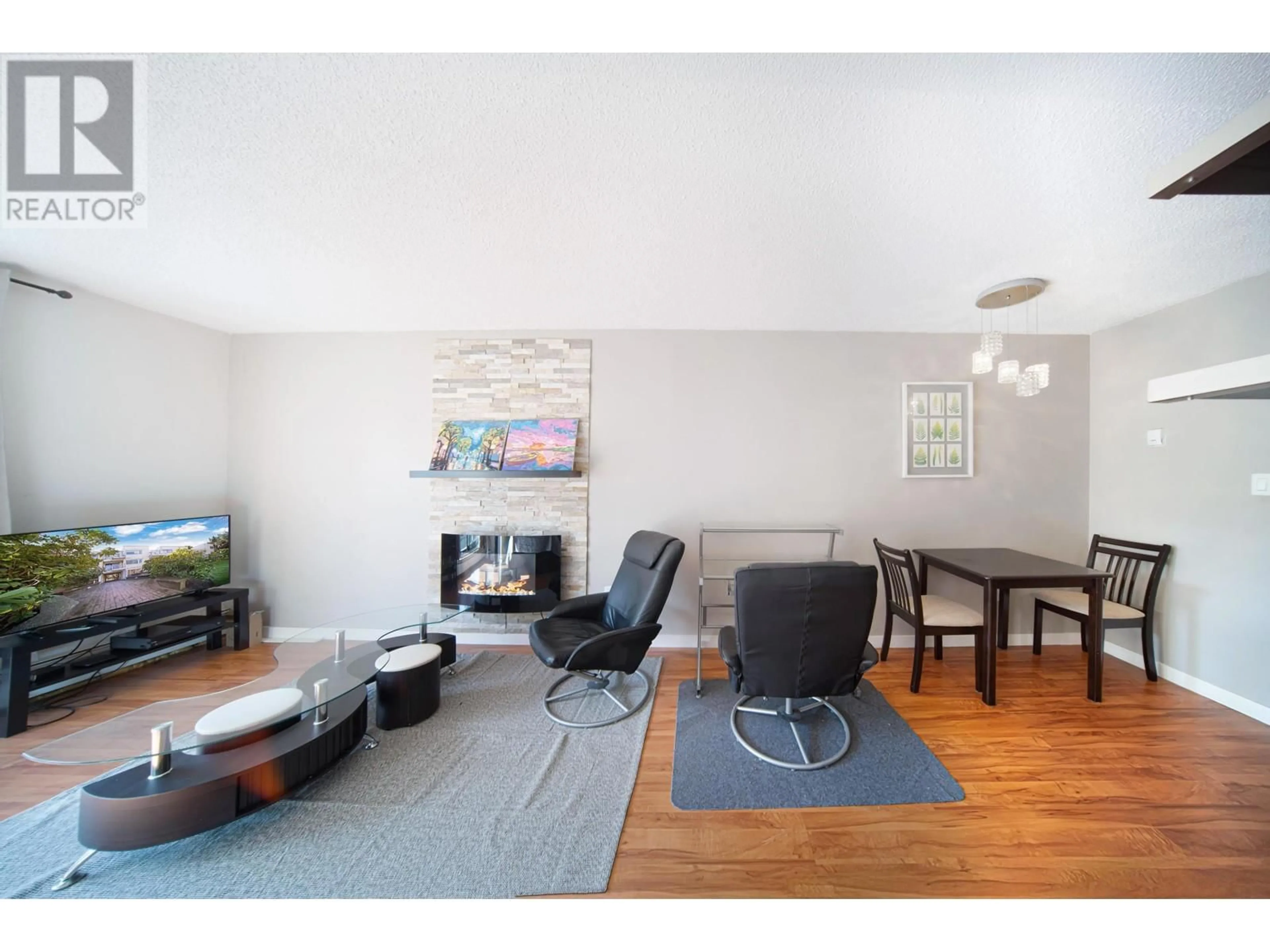 Living room with furniture, wood/laminate floor for 313 - 830 7TH AVENUE, Vancouver British Columbia V5T4J2
