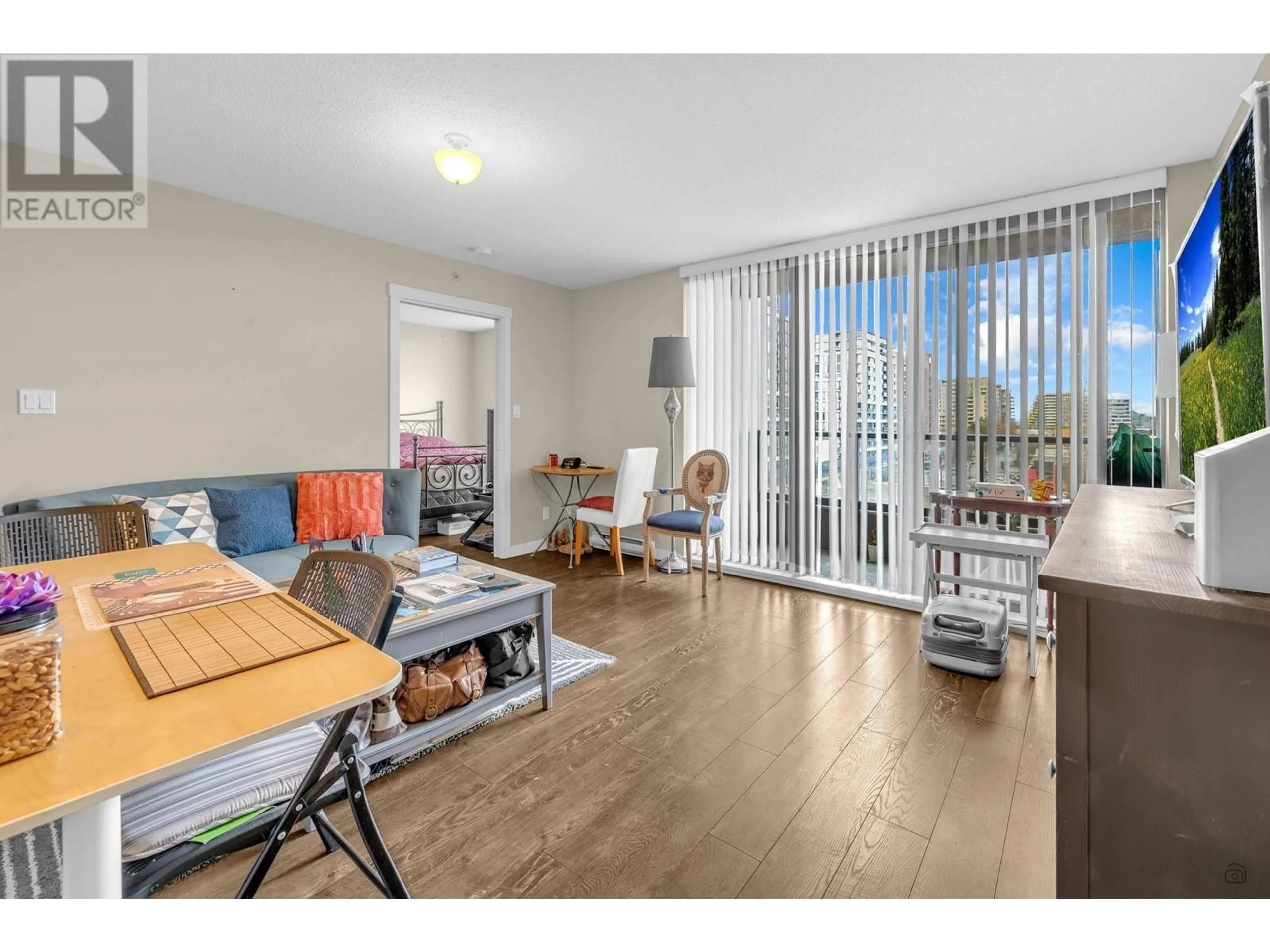 Living room with furniture, wood/laminate floor for 813 5811 NO. 3 ROAD, Richmond British Columbia V6X4L7