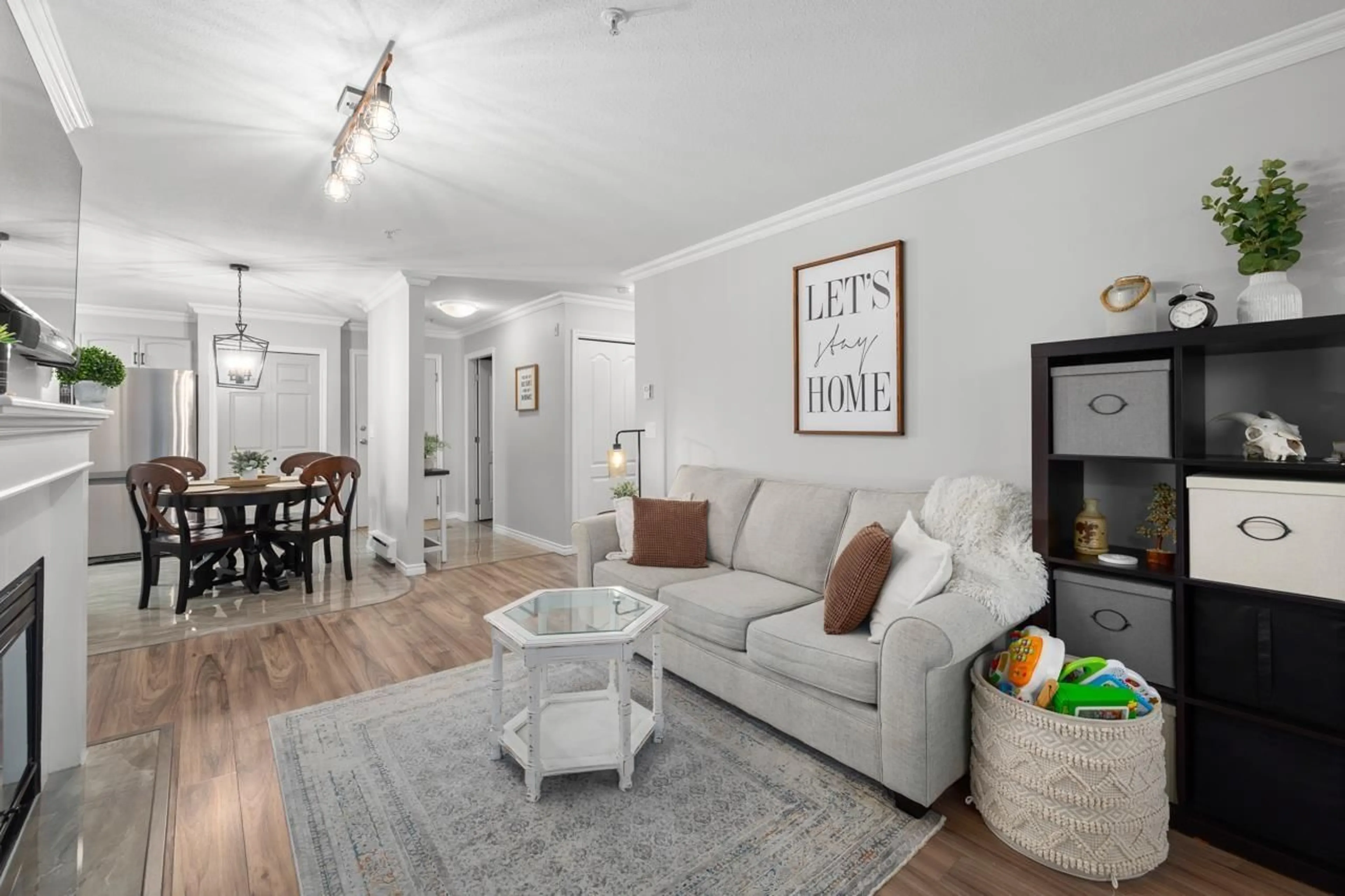 Living room with furniture, wood/laminate floor for 310 - 2958 TRETHEWEY, Abbotsford British Columbia V2T6P6
