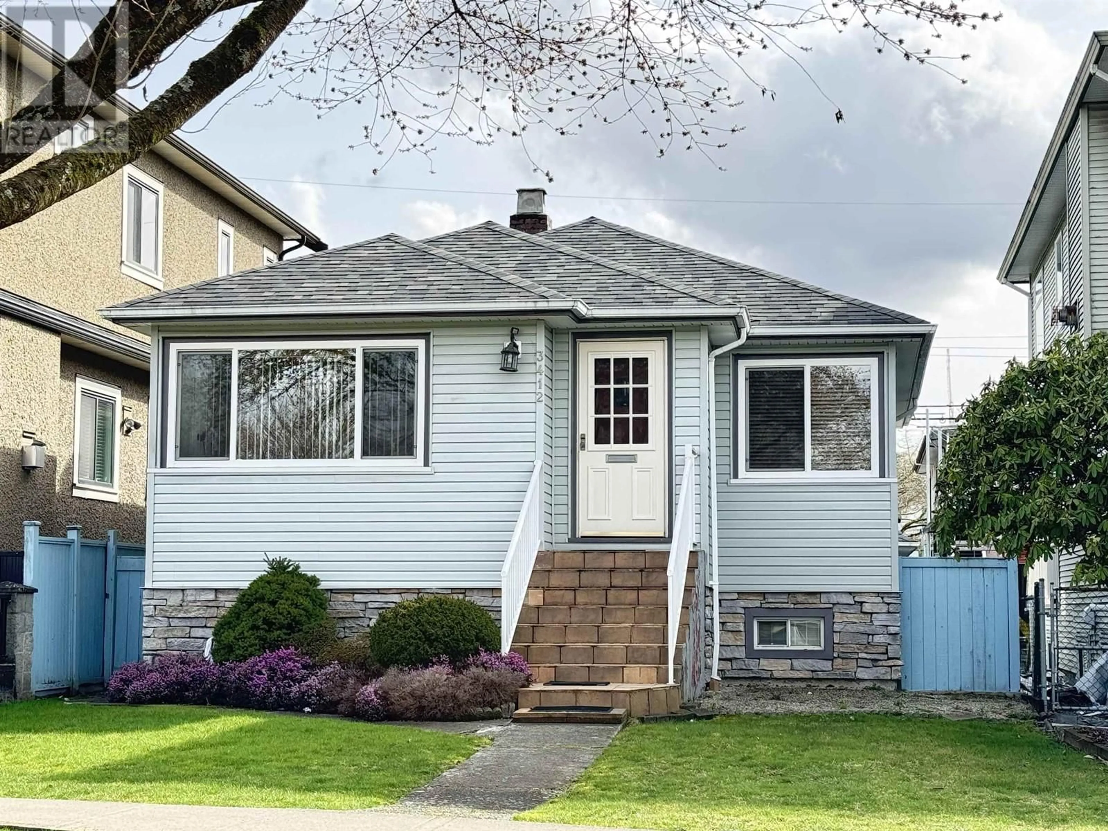 Home with vinyl exterior material, street for 3412 E 23RD AVENUE, Vancouver British Columbia V5R1C2