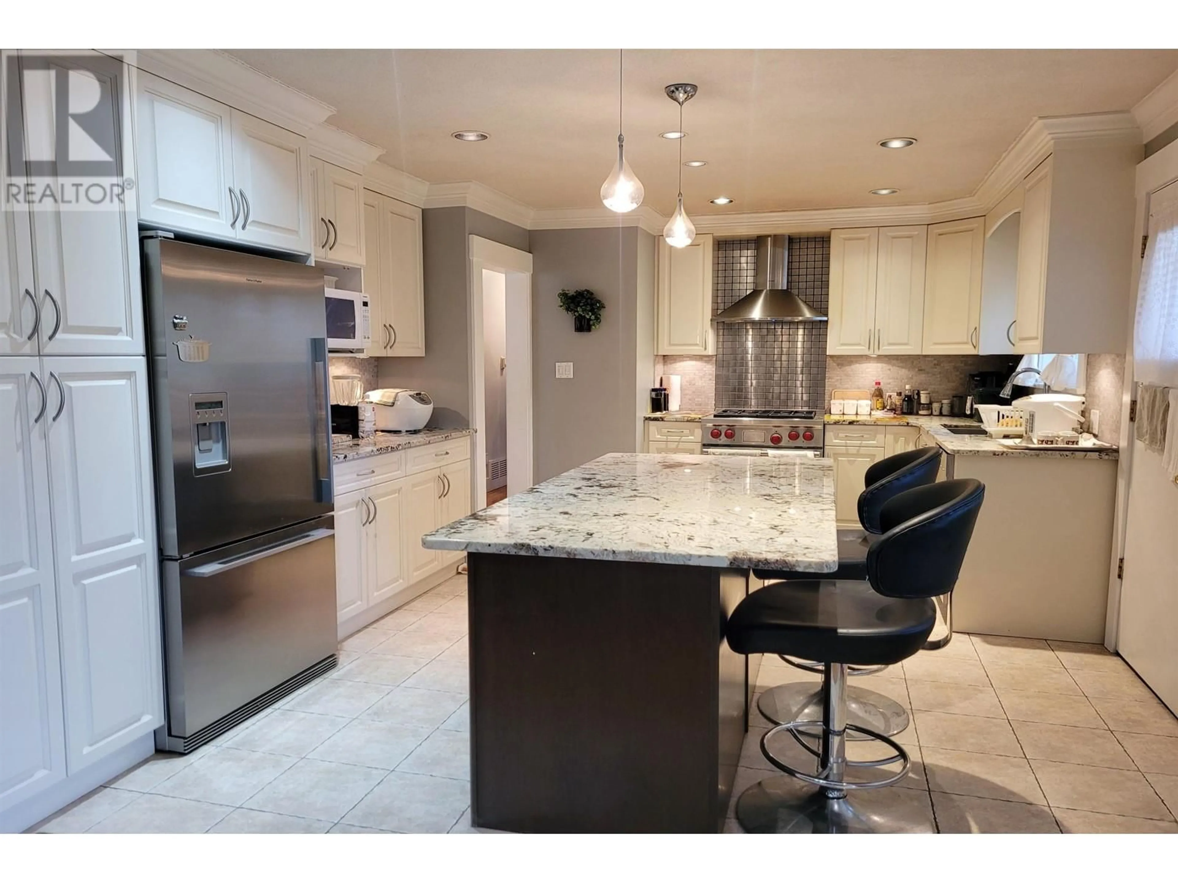 Open concept kitchen, ceramic/tile floor for 7921 BURNFIELD CRESCENT, Burnaby British Columbia V5E2B8