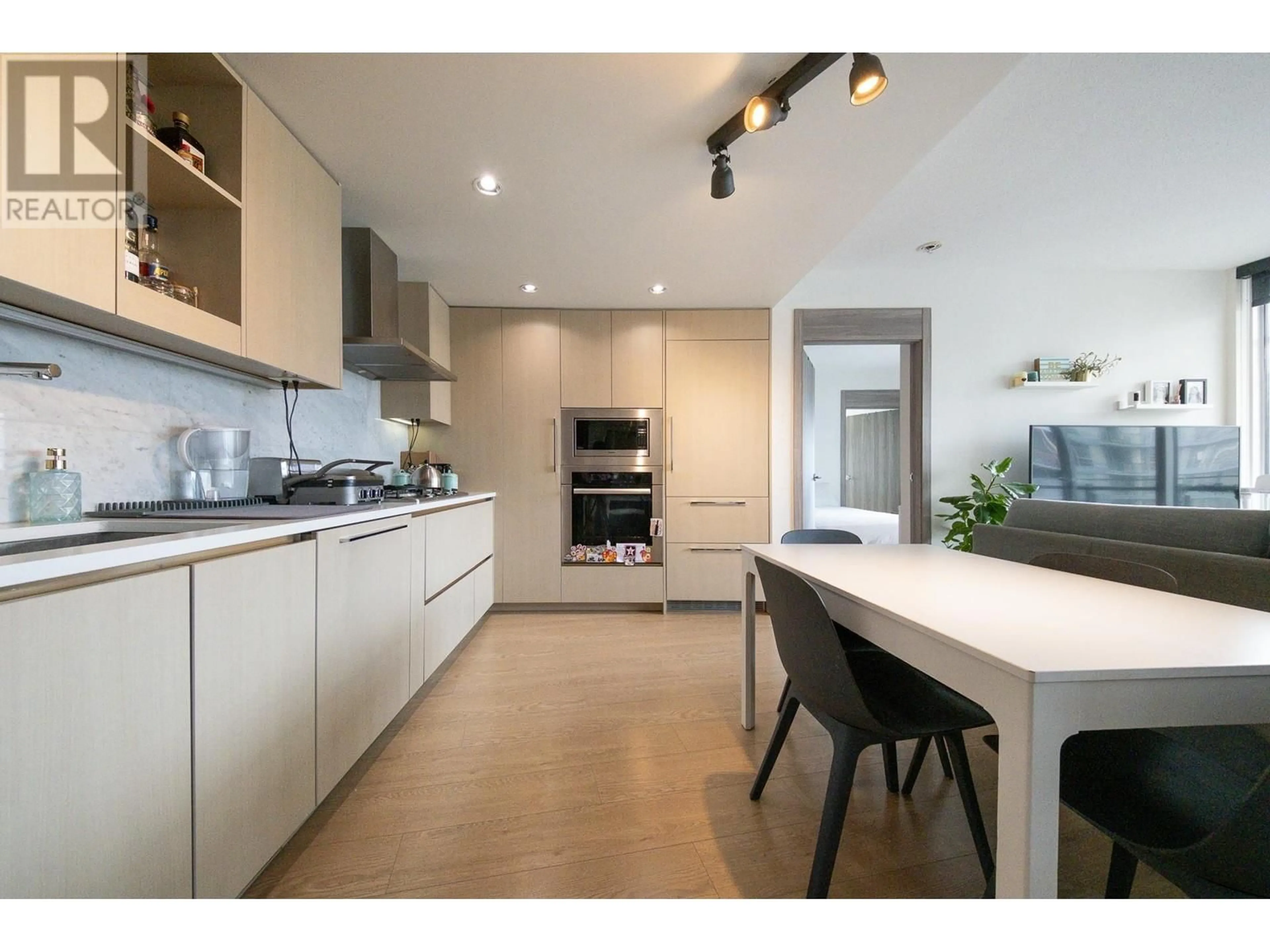 Contemporary kitchen, wood/laminate floor for 2001 - 89 NELSON STREET, Vancouver British Columbia V6Z0E7