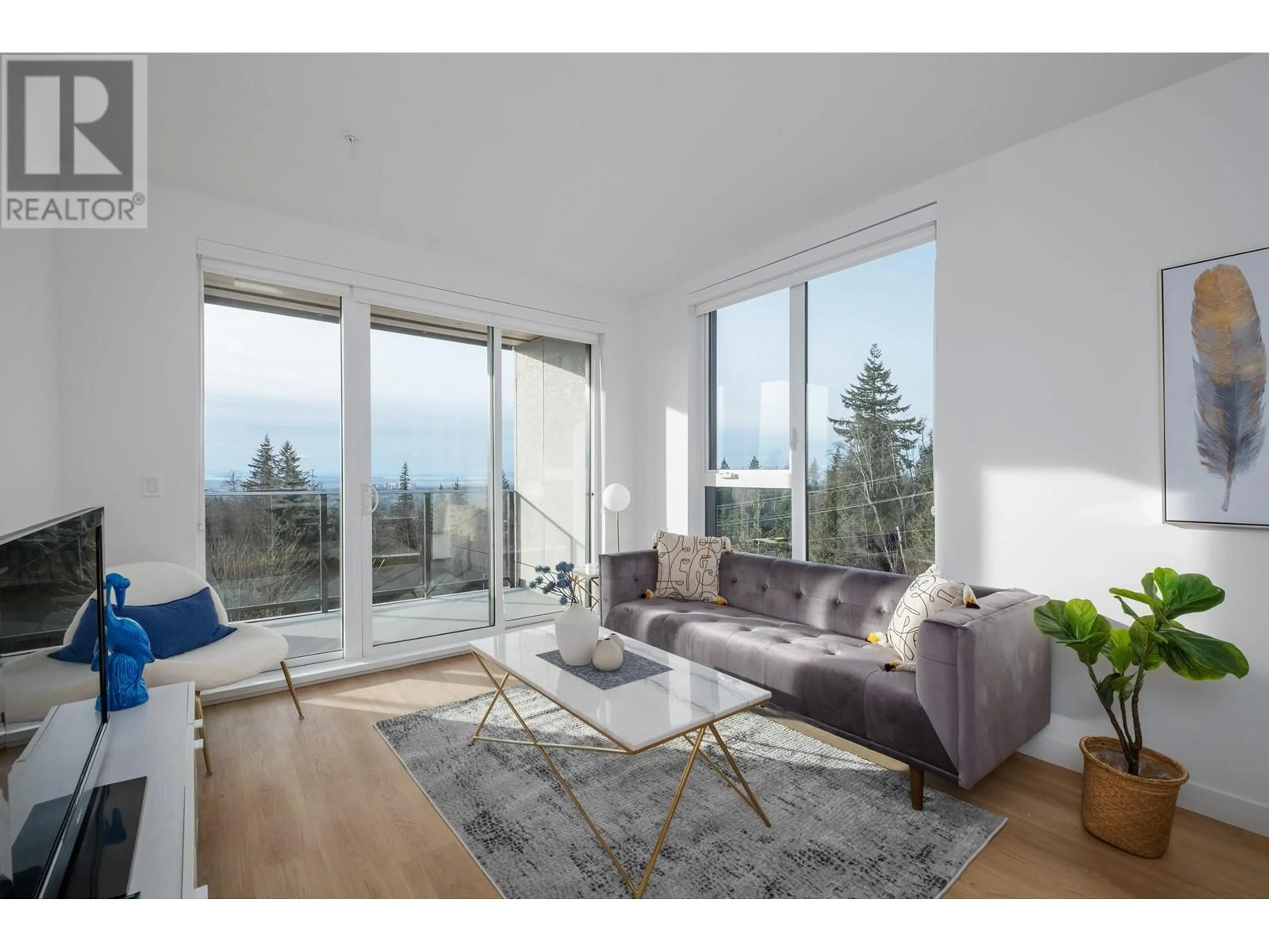Living room with furniture, wood/laminate floor for 409 - 9888 UNIVERSITY CRESCENT, Burnaby British Columbia V5A0G4