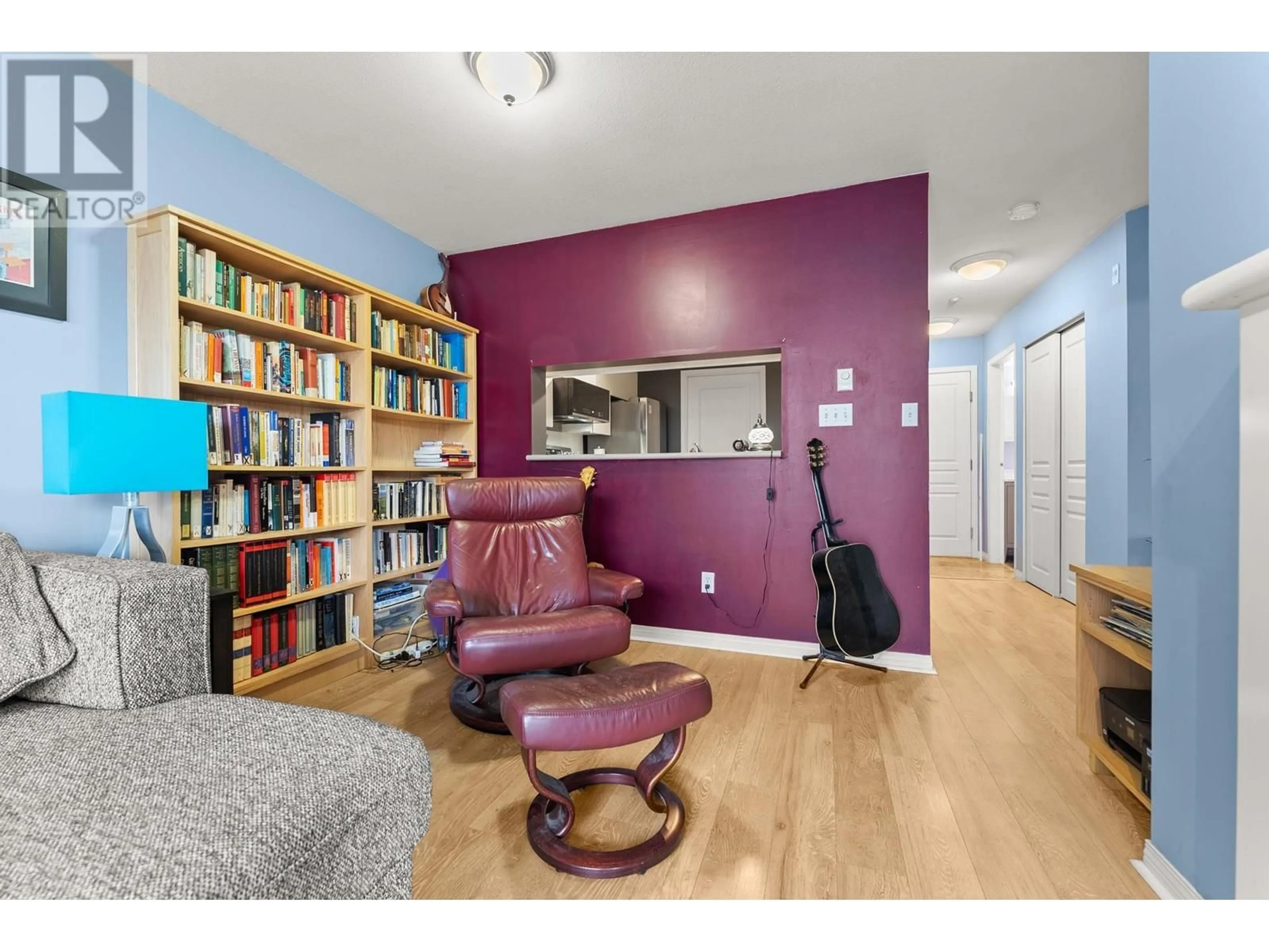 Living room with furniture, wood/laminate floor for 103 - 8420 JELLICOE STREET, Vancouver British Columbia V5S4T1