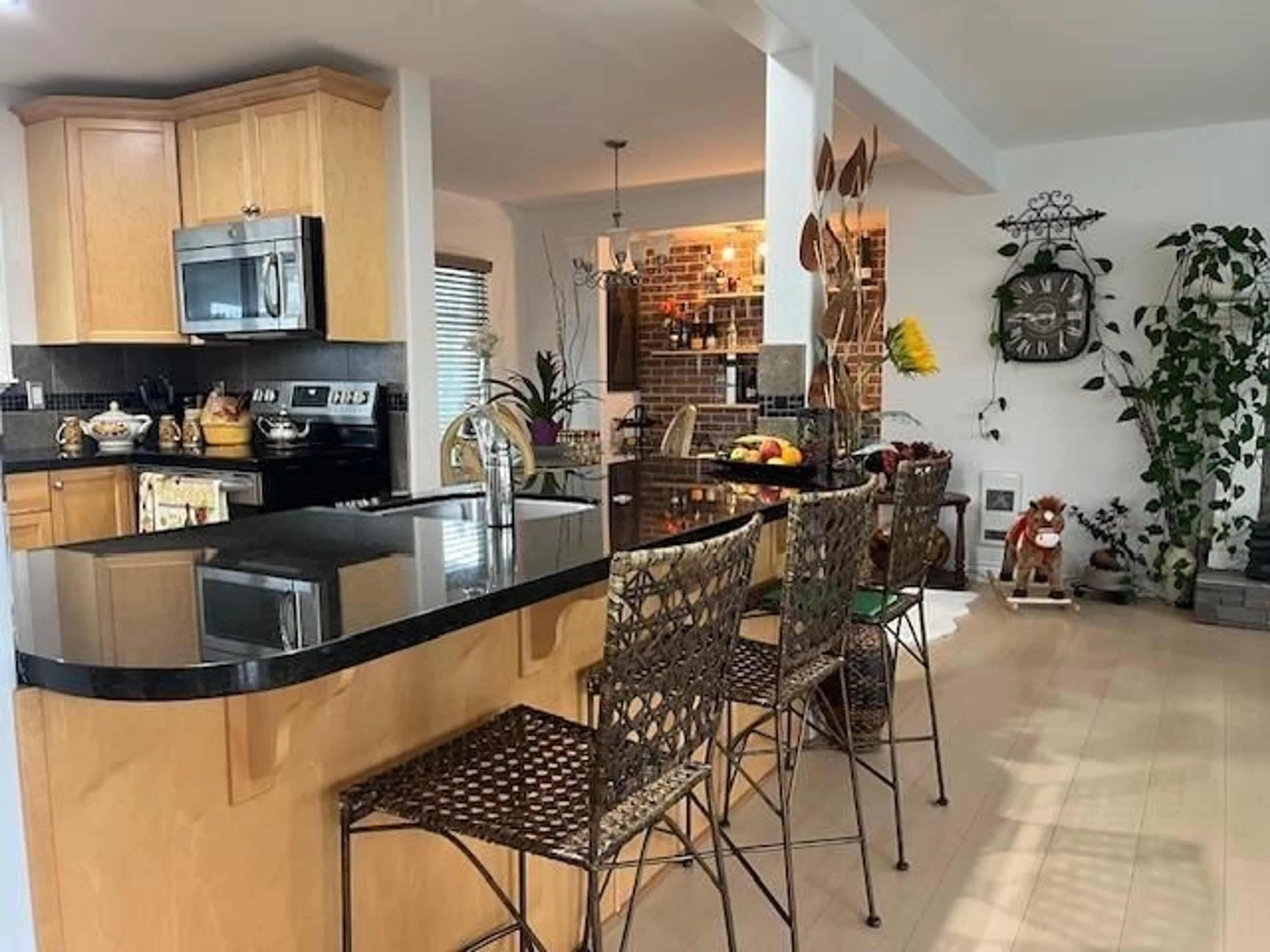 Open concept kitchen, ceramic/tile floor for 7055 SESAME STREET, Chilliwack British Columbia V2R3T3