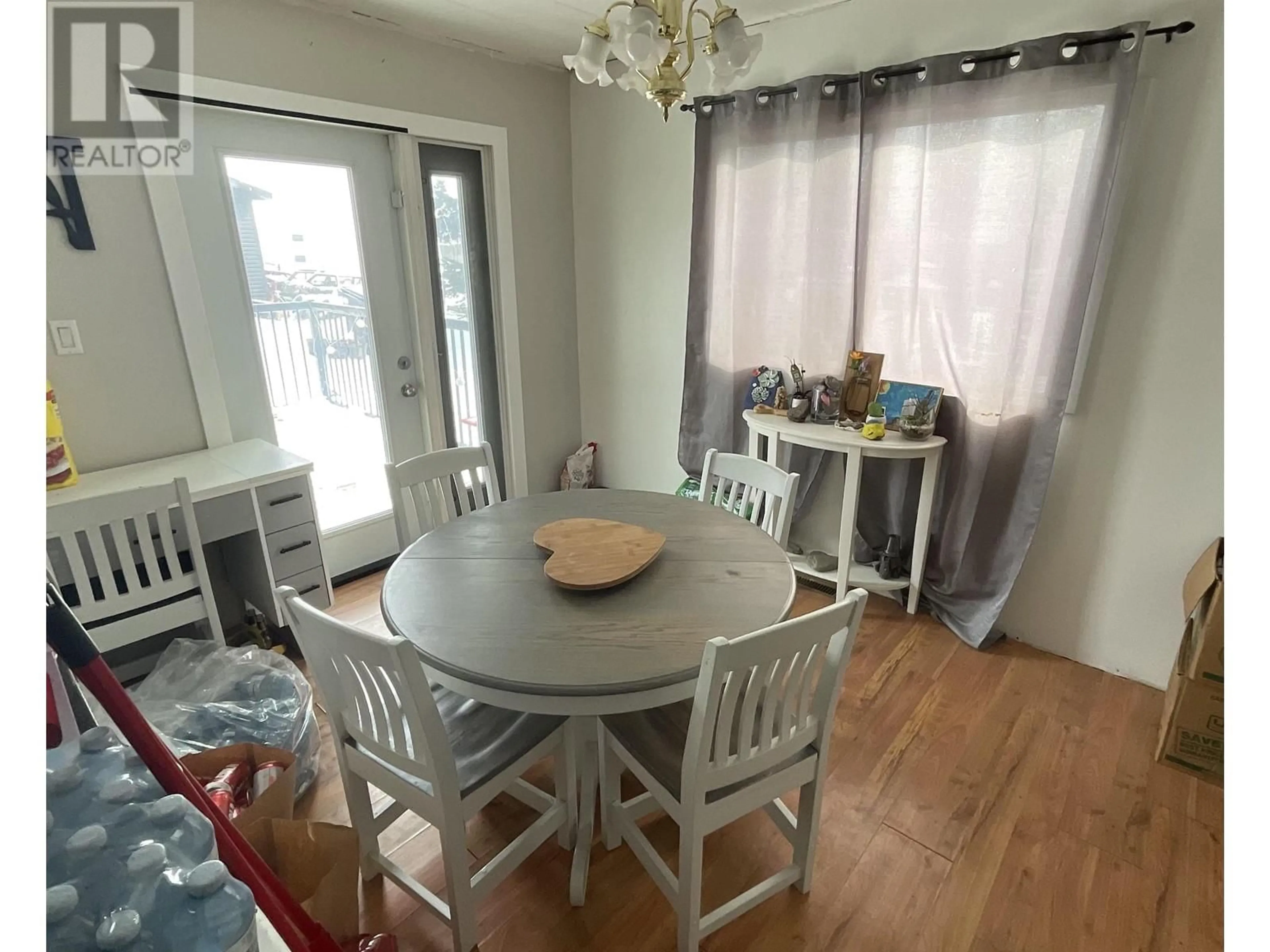 Dining room, wood/laminate floor for 9108 PINE ROAD, Fort St. John British Columbia V1J4M7