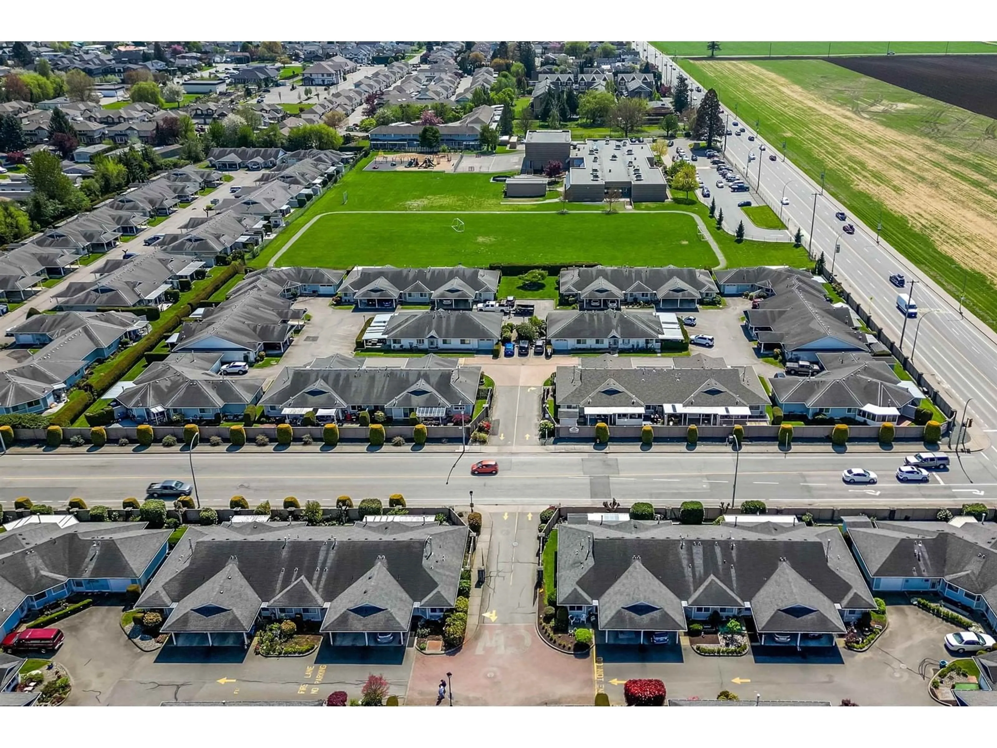 A pic from outside/outdoor area/front of a property/back of a property/a pic from drone, street for 106 - 7610 EVANS ROAD, Chilliwack British Columbia V2R2X8