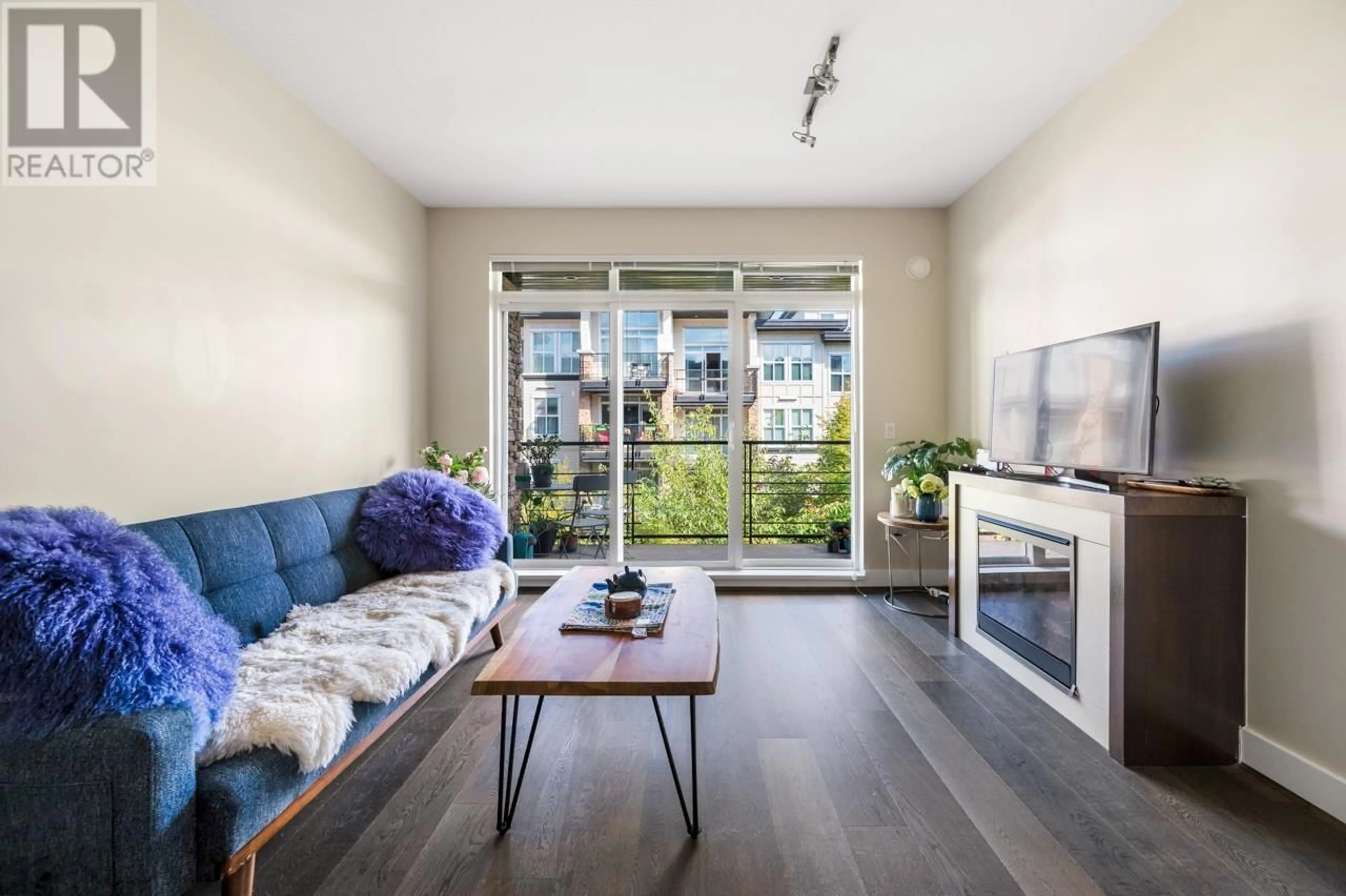 Living room with furniture, wood/laminate floor for 303 - 5928 BIRNEY AVENUE, Vancouver British Columbia V6S0B5