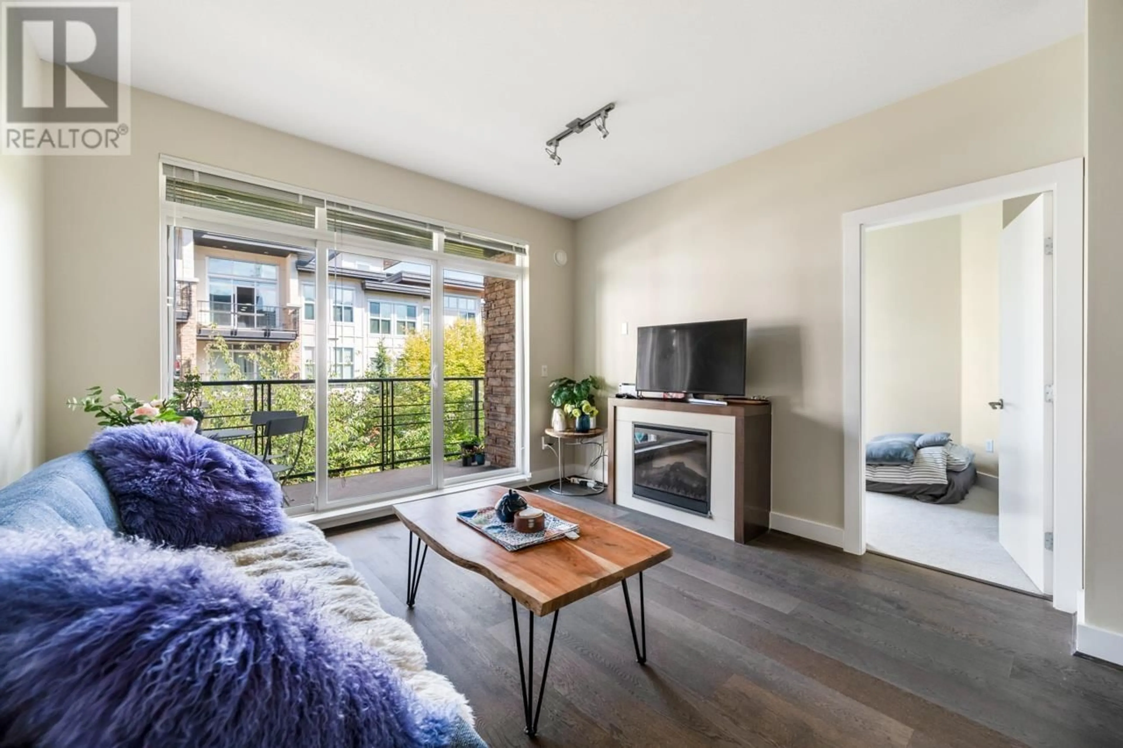 Living room with furniture, wood/laminate floor for 303 - 5928 BIRNEY AVENUE, Vancouver British Columbia V6S0B5
