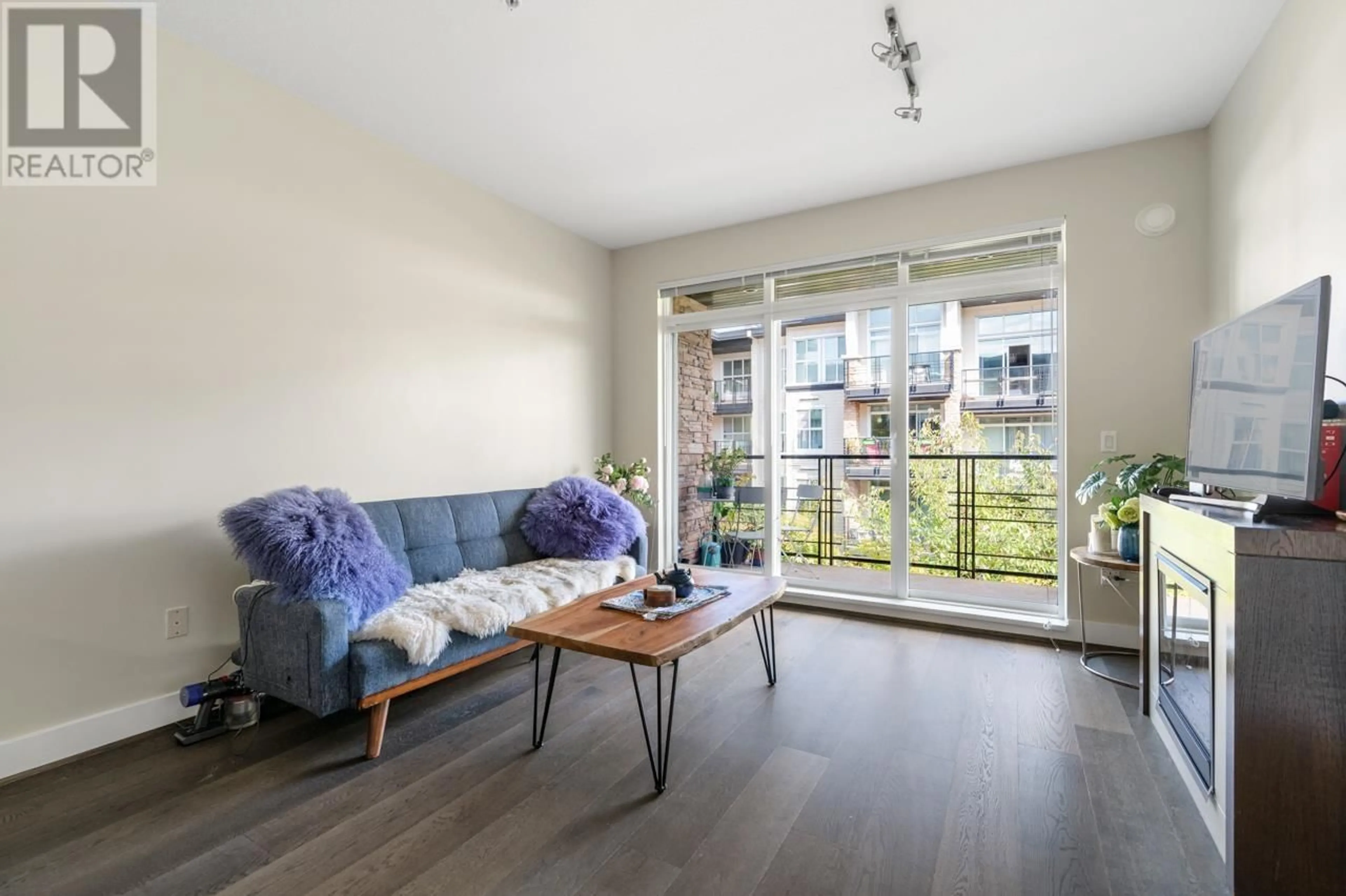 Living room with furniture, wood/laminate floor for 303 - 5928 BIRNEY AVENUE, Vancouver British Columbia V6S0B5