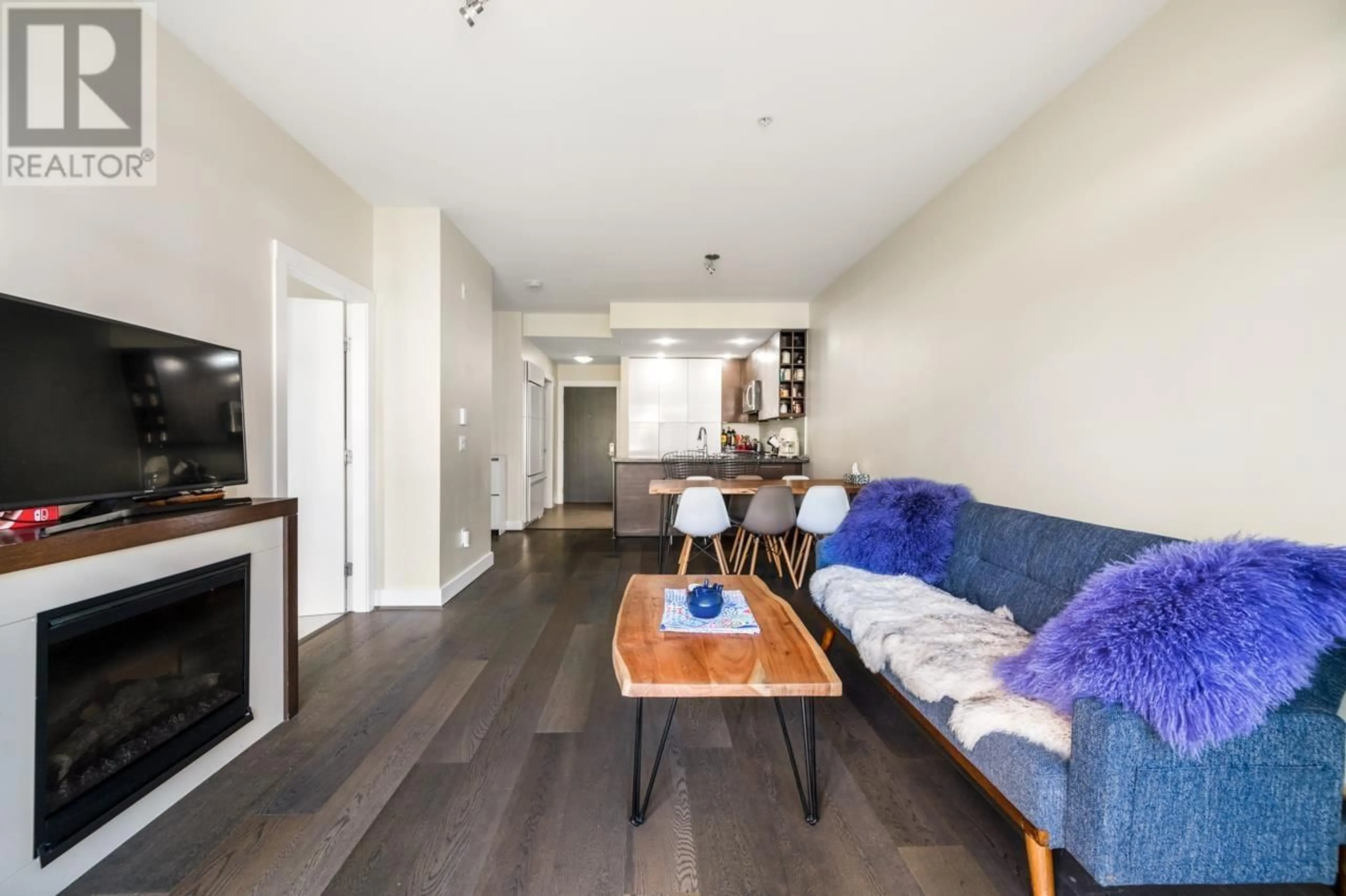 Living room with furniture, wood/laminate floor for 303 - 5928 BIRNEY AVENUE, Vancouver British Columbia V6S0B5