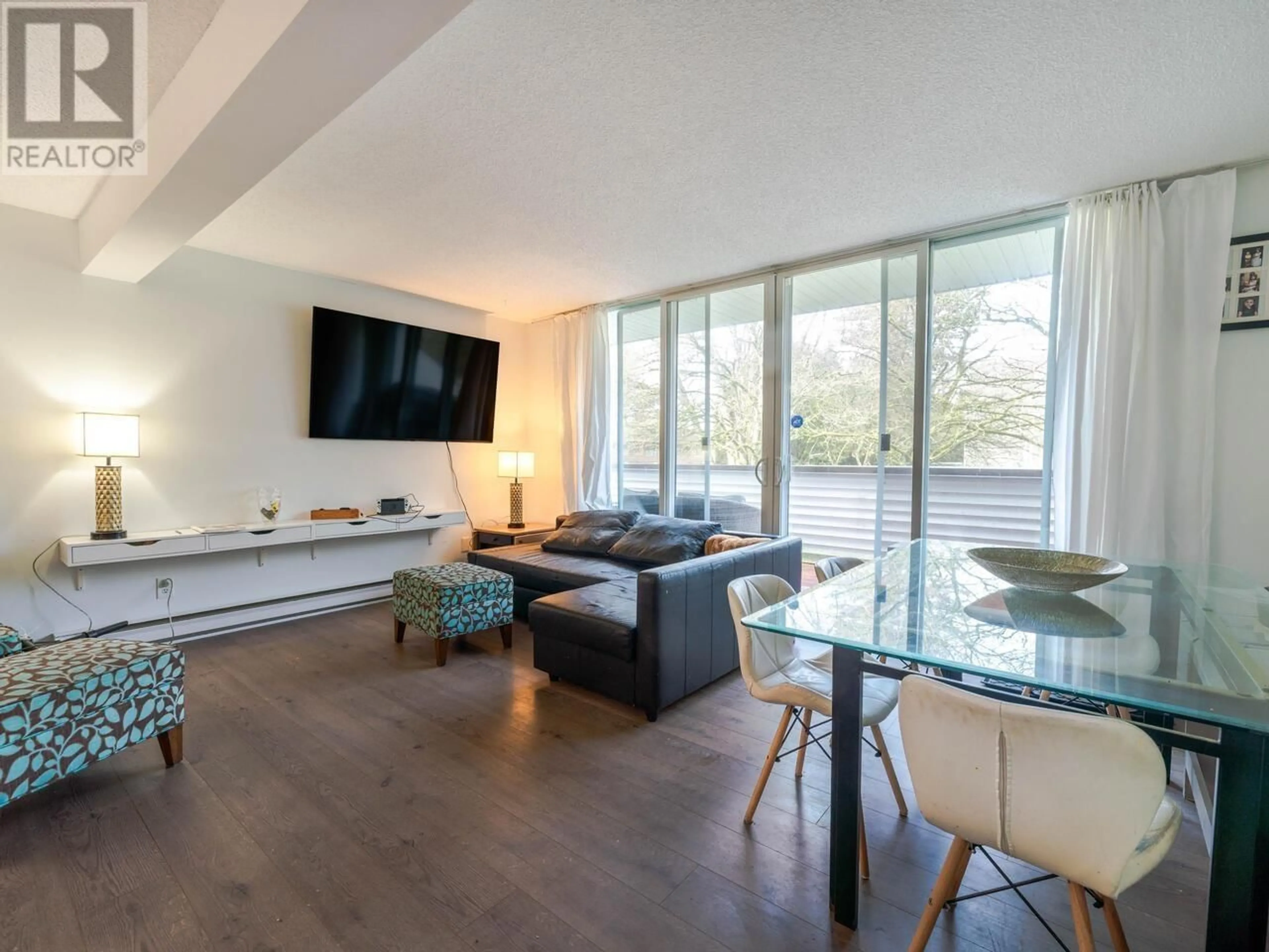 Living room with furniture, wood/laminate floor for 116 - 9151 NO. 5 ROAD, Richmond British Columbia V7A4T9