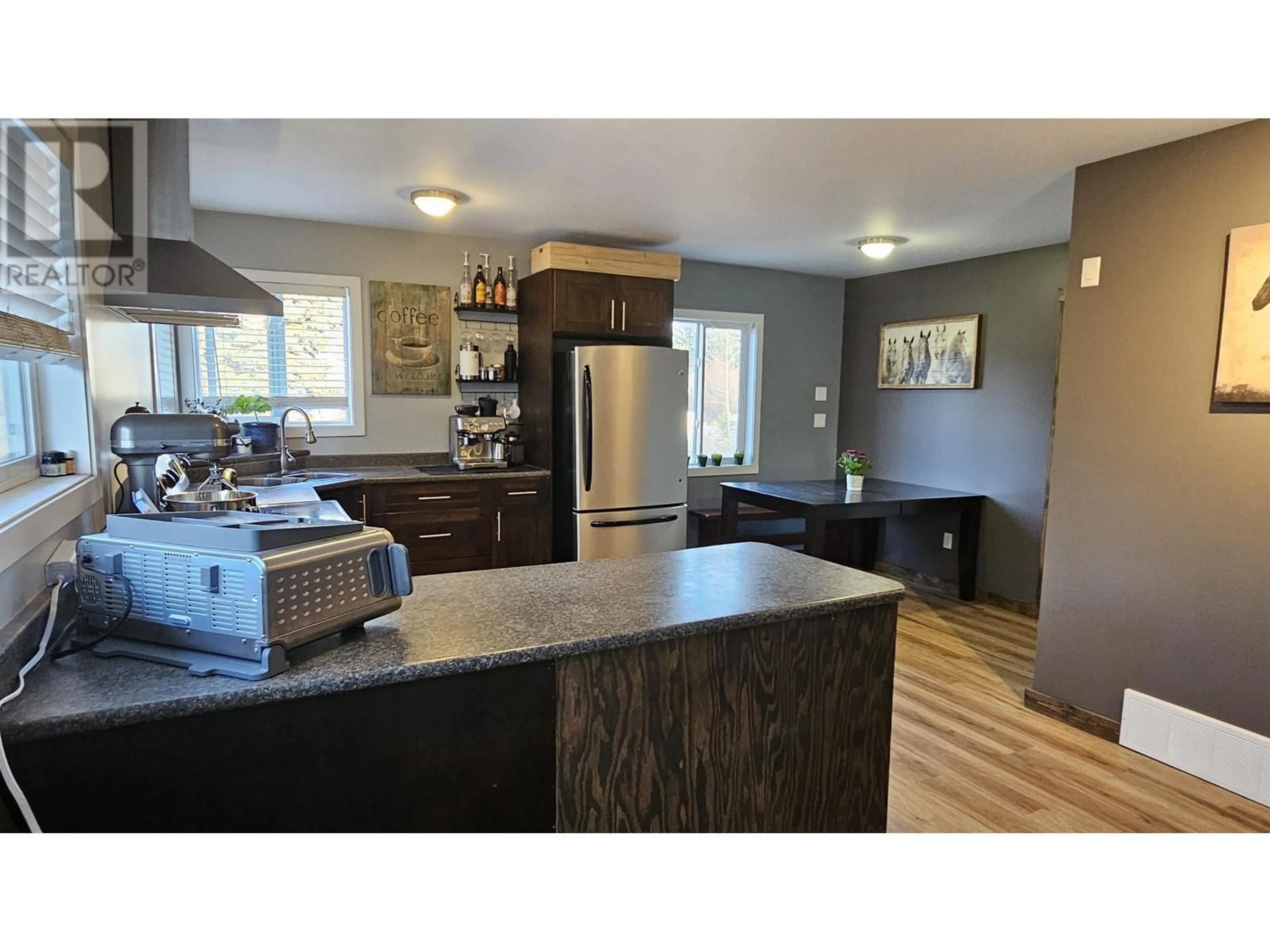 Open concept kitchen, wood/laminate floor for 1785 BIRCH AVENUE, Quesnel British Columbia V2J3Y3