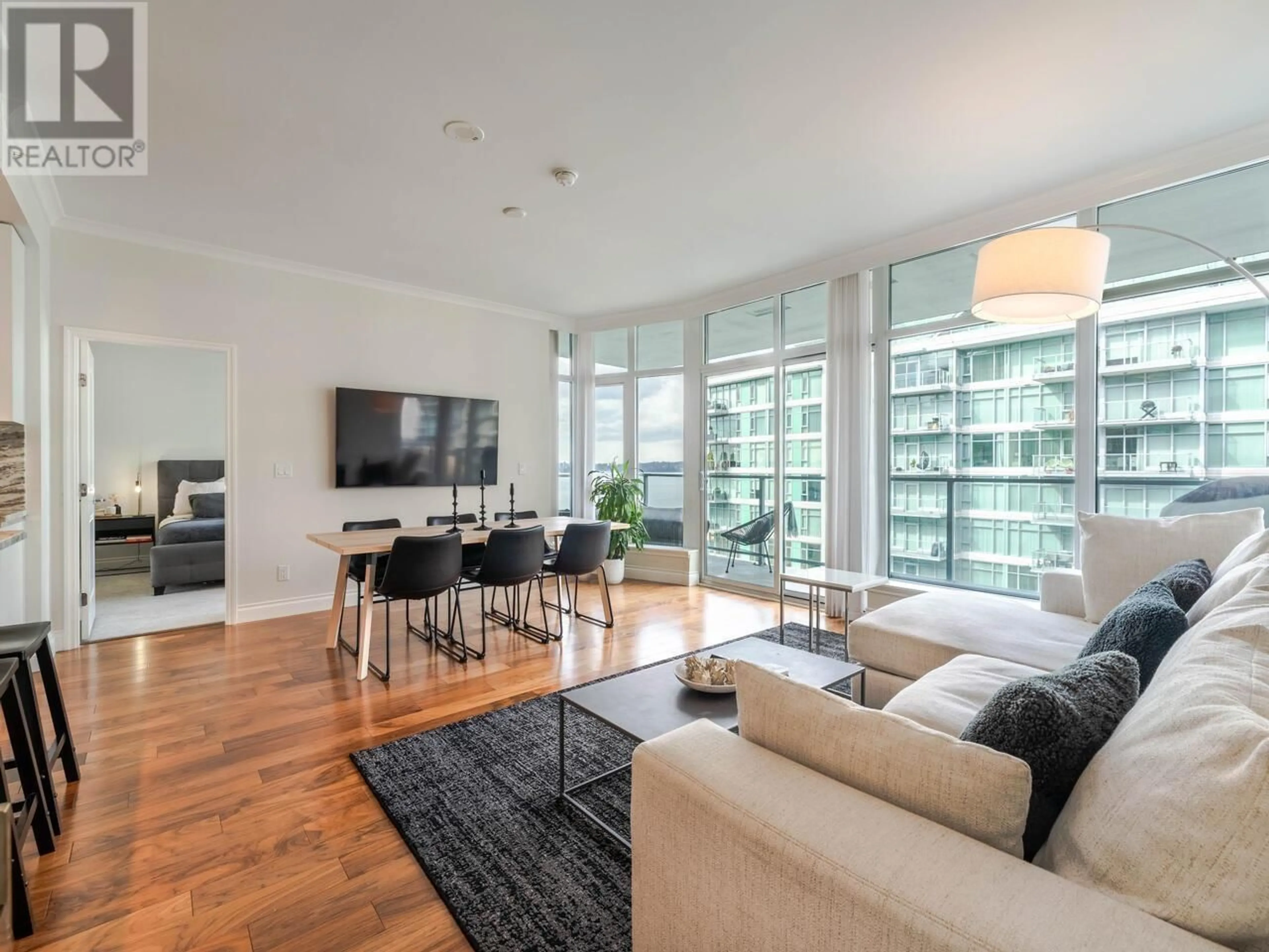 Living room with furniture, unknown for 604 - 185 VICTORY SHIP WAY, North Vancouver British Columbia V7L0G2