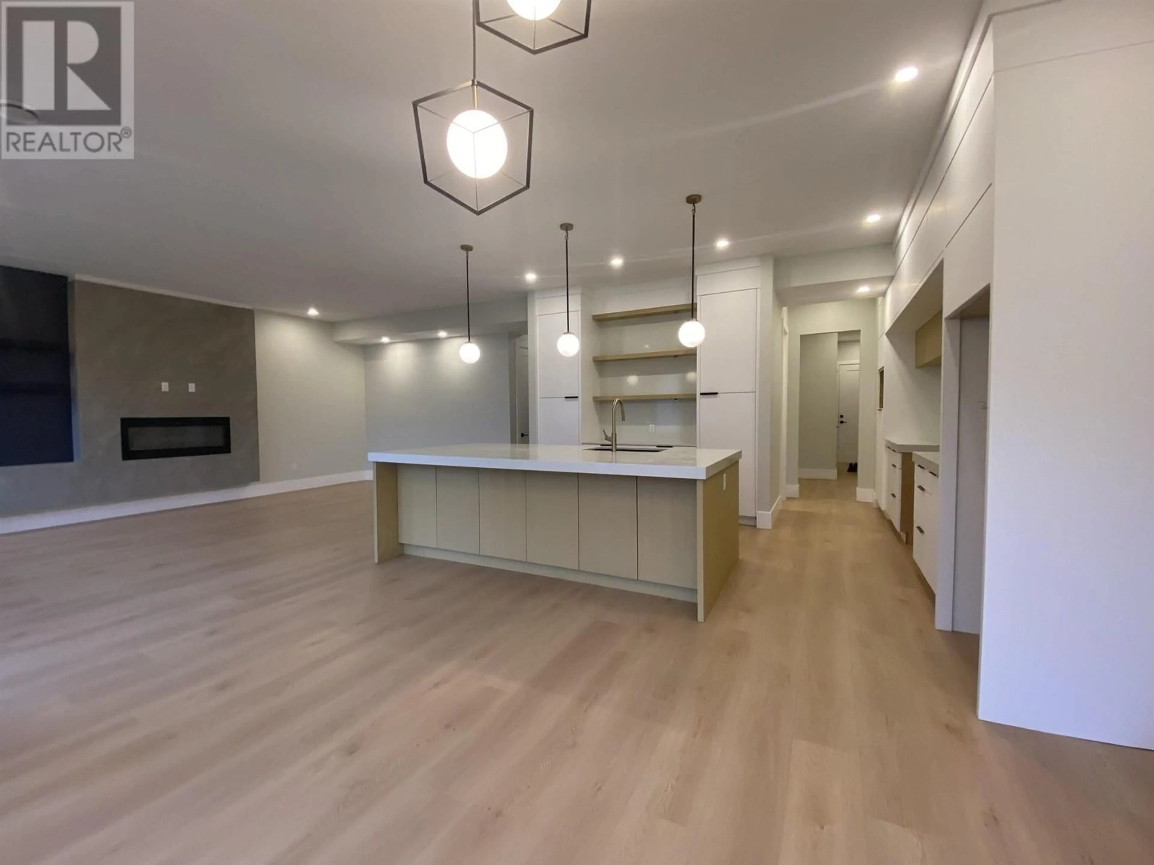 Open concept kitchen, wood/laminate floor for 4001 NASH DRIVE, Terrace British Columbia V8G0L3