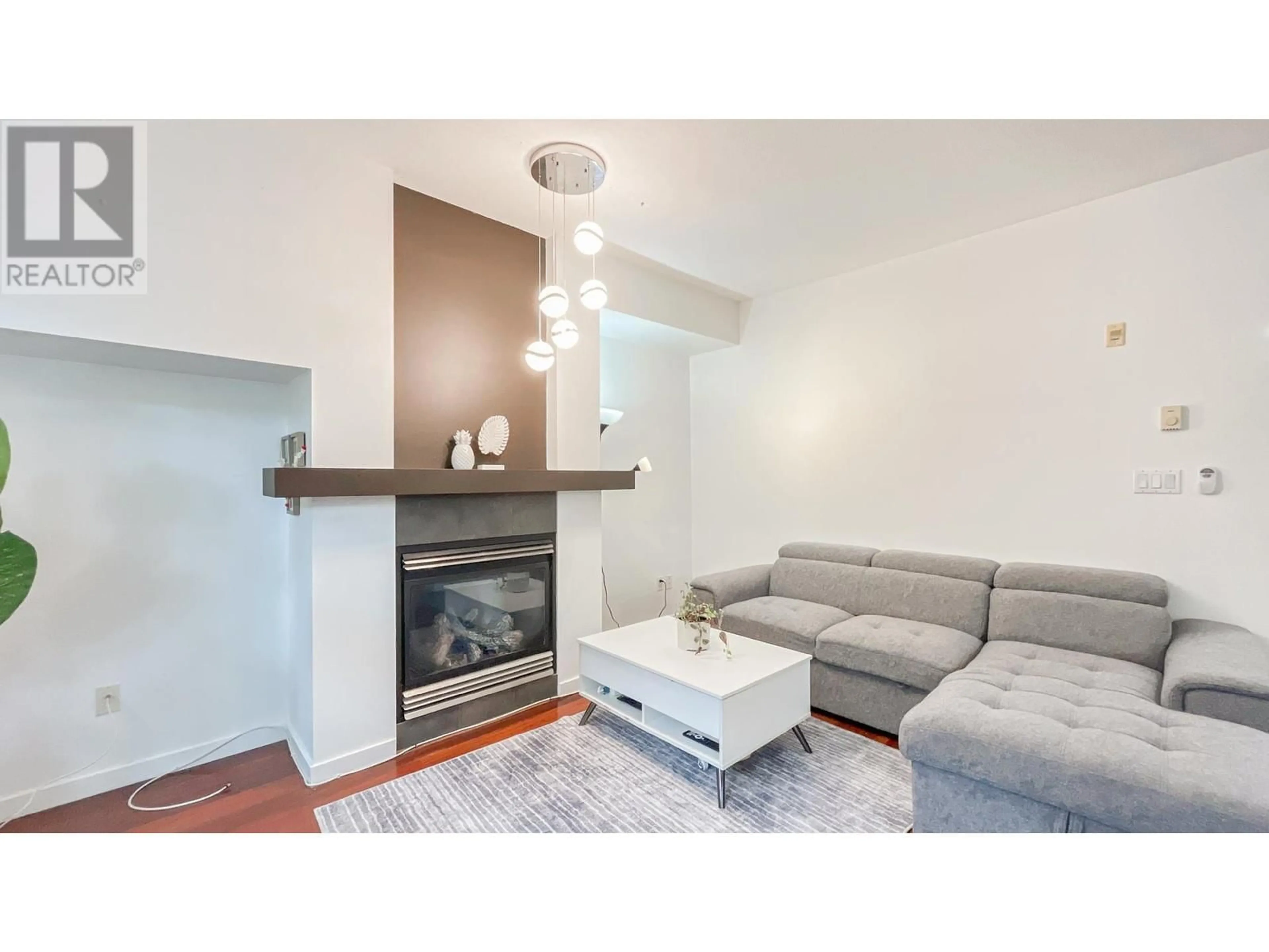 Living room with furniture, wood/laminate floor for 41 - 6528 DENBIGH AVENUE, Burnaby British Columbia V5H3R8