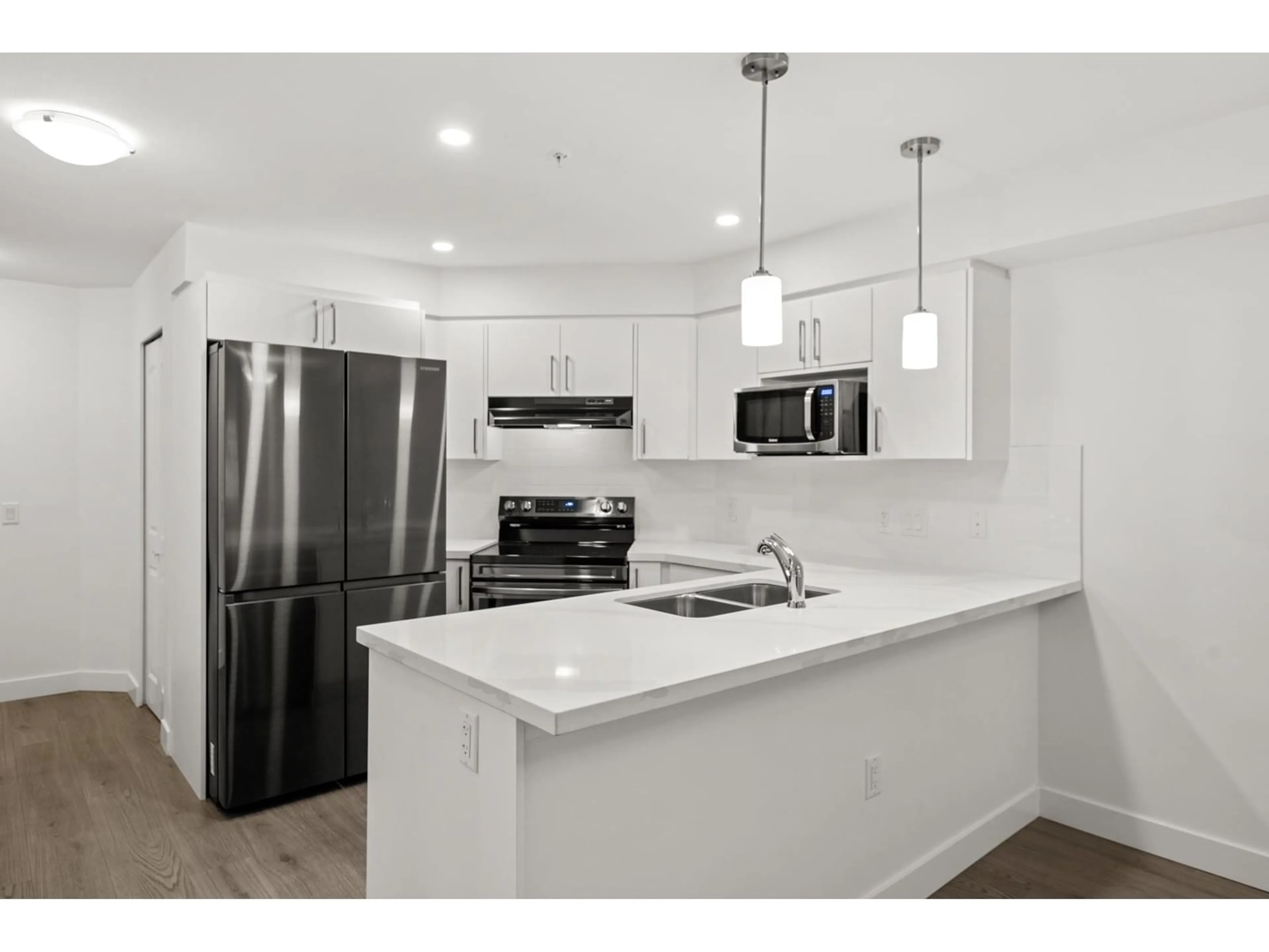 Open concept kitchen, unknown for 110 19730 56 AVENUE, Langley British Columbia V3A3X6