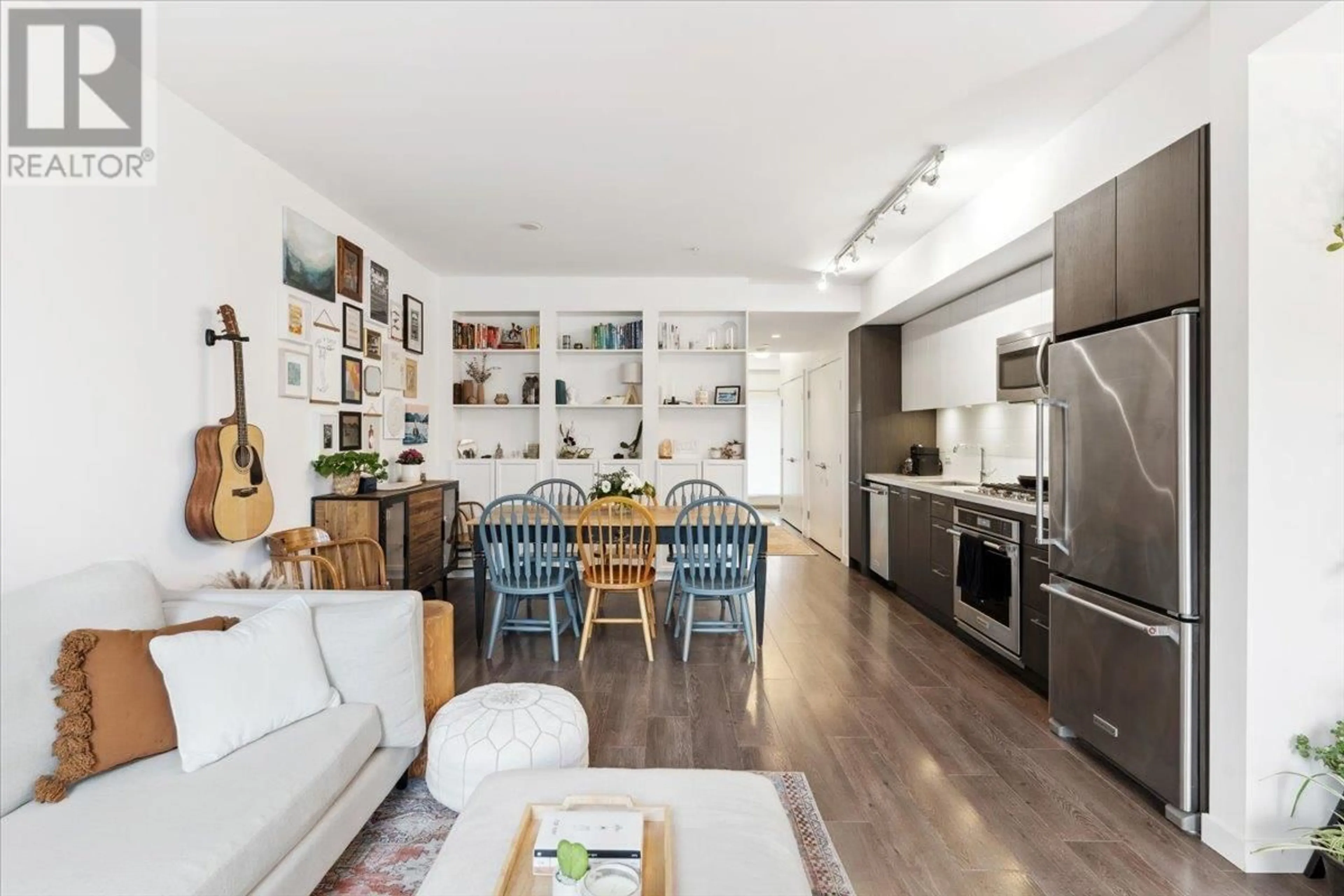 Open concept kitchen, wood/laminate floor for 404 - 417 GREAT NORTHERN WAY, Vancouver British Columbia V5T0G7