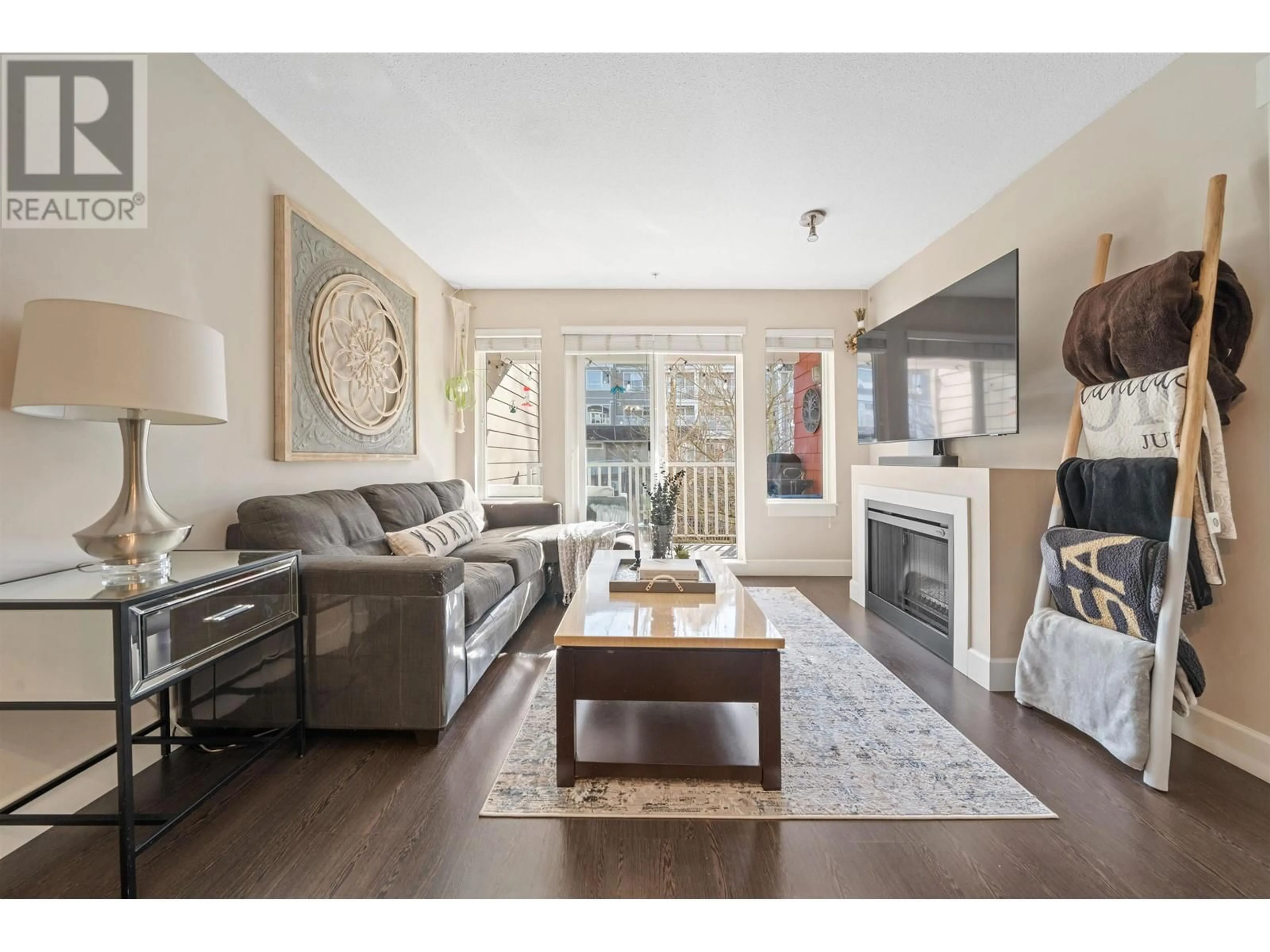 Living room with furniture, wood/laminate floor for 213 - 12283 224 STREET, Maple Ridge British Columbia V2X8Z3